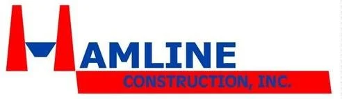 Logo for Amline Construction, Inc., featuring red and blue text and a stylized red 'M'
