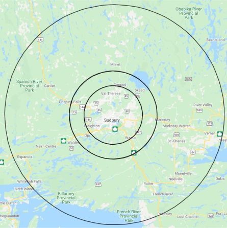 Map showing Sudbury, Ontario, with concentric circles around the city indicating distances. Major roads and parks like Killarney Provincial Park and French River Provincial Park are visible.