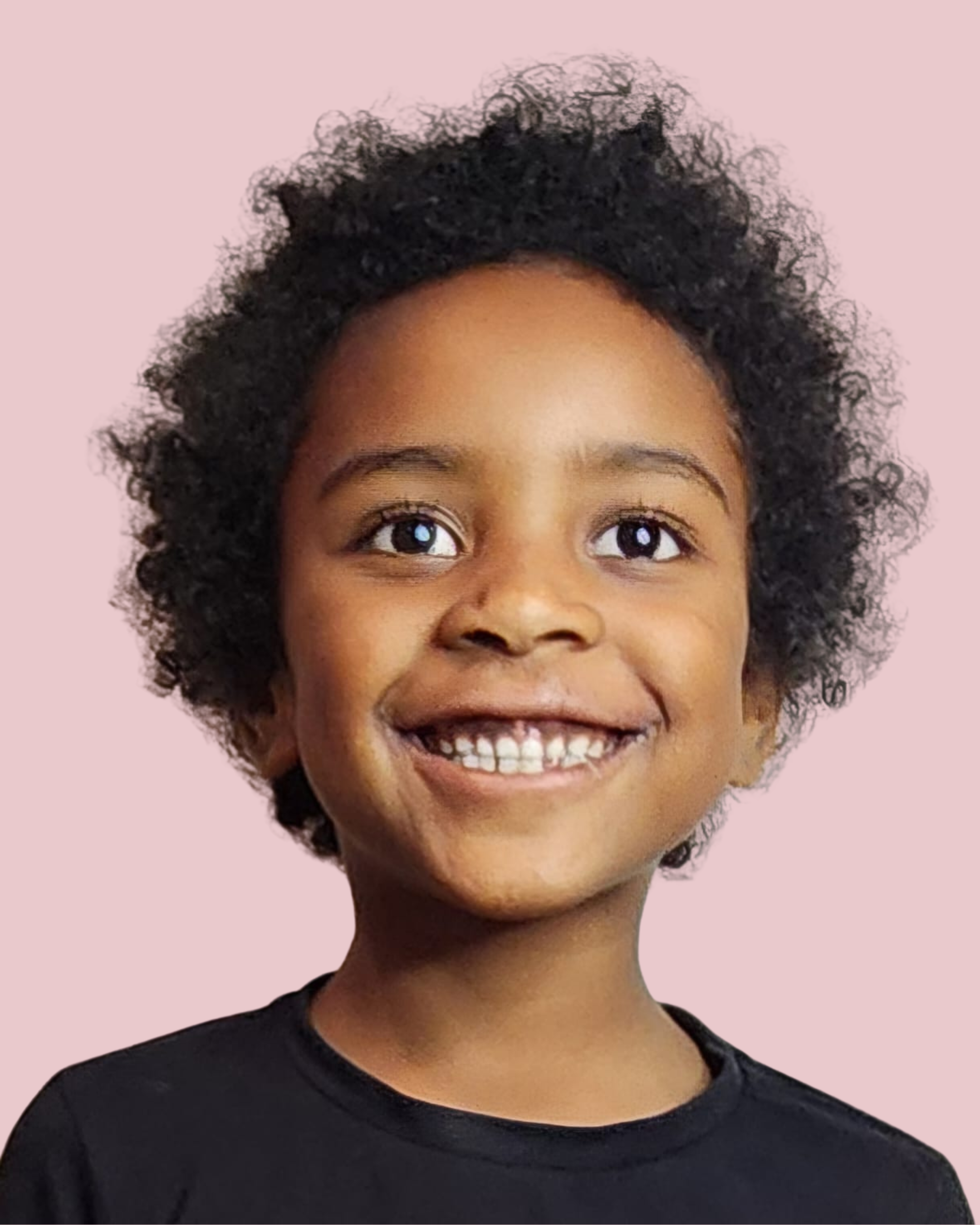 Close-up of a smiling young girl with curly hair, wearing a black shirt, against a light pink background.
