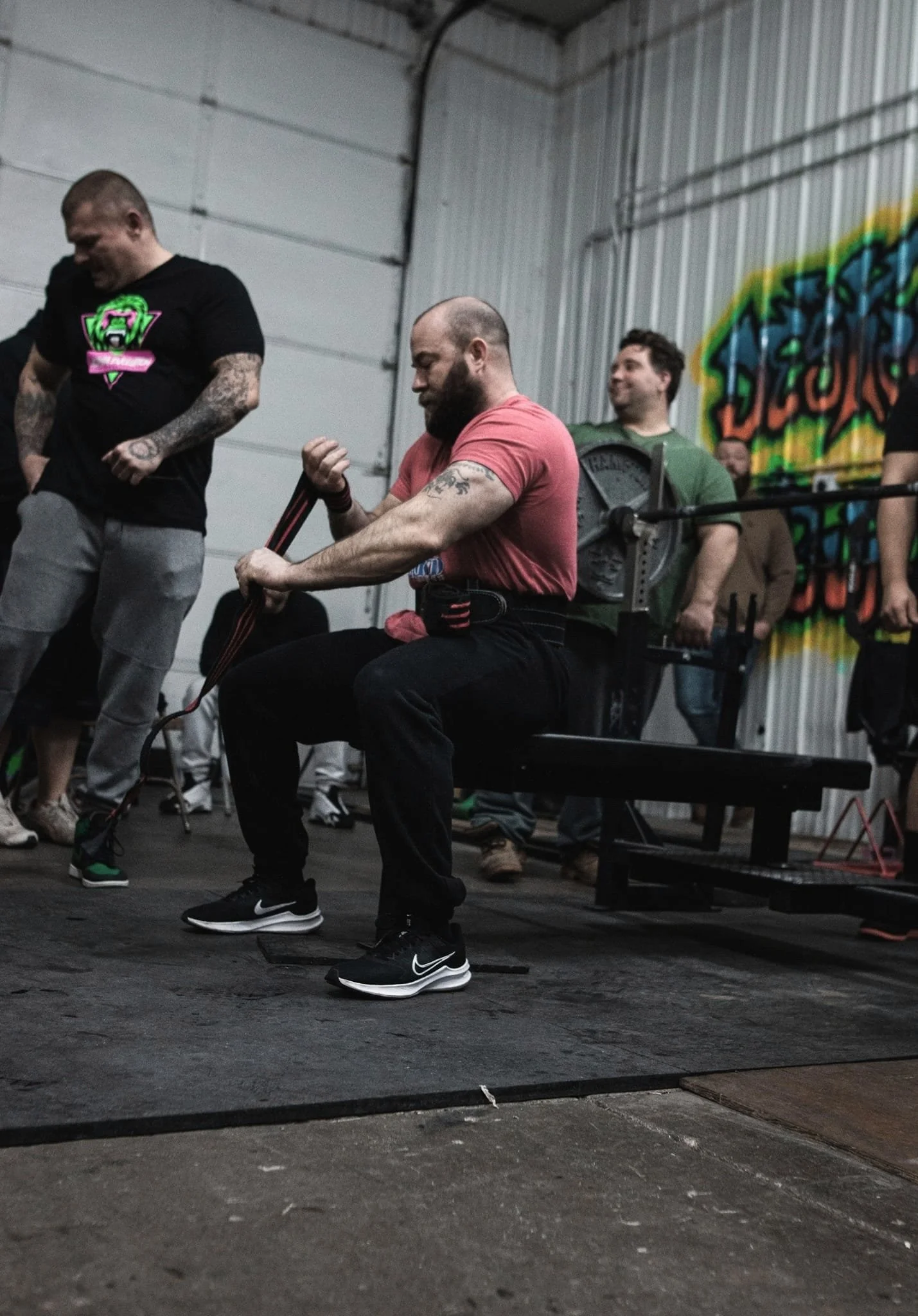 Spotters assisting lifters during the Bench Blast event at Alpha Evolution Gym in Newark, Ohio — team support and safety in powerlifting