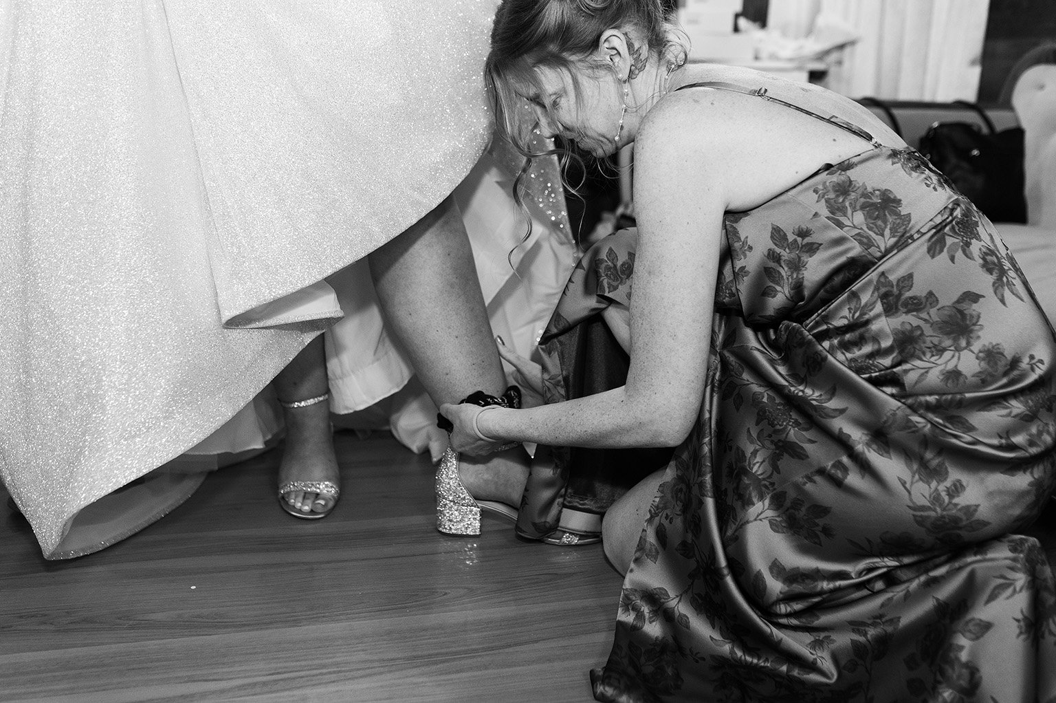 Bride putting on shoes at the Hope Glen Farm in Cottage Grove, Minnesota.