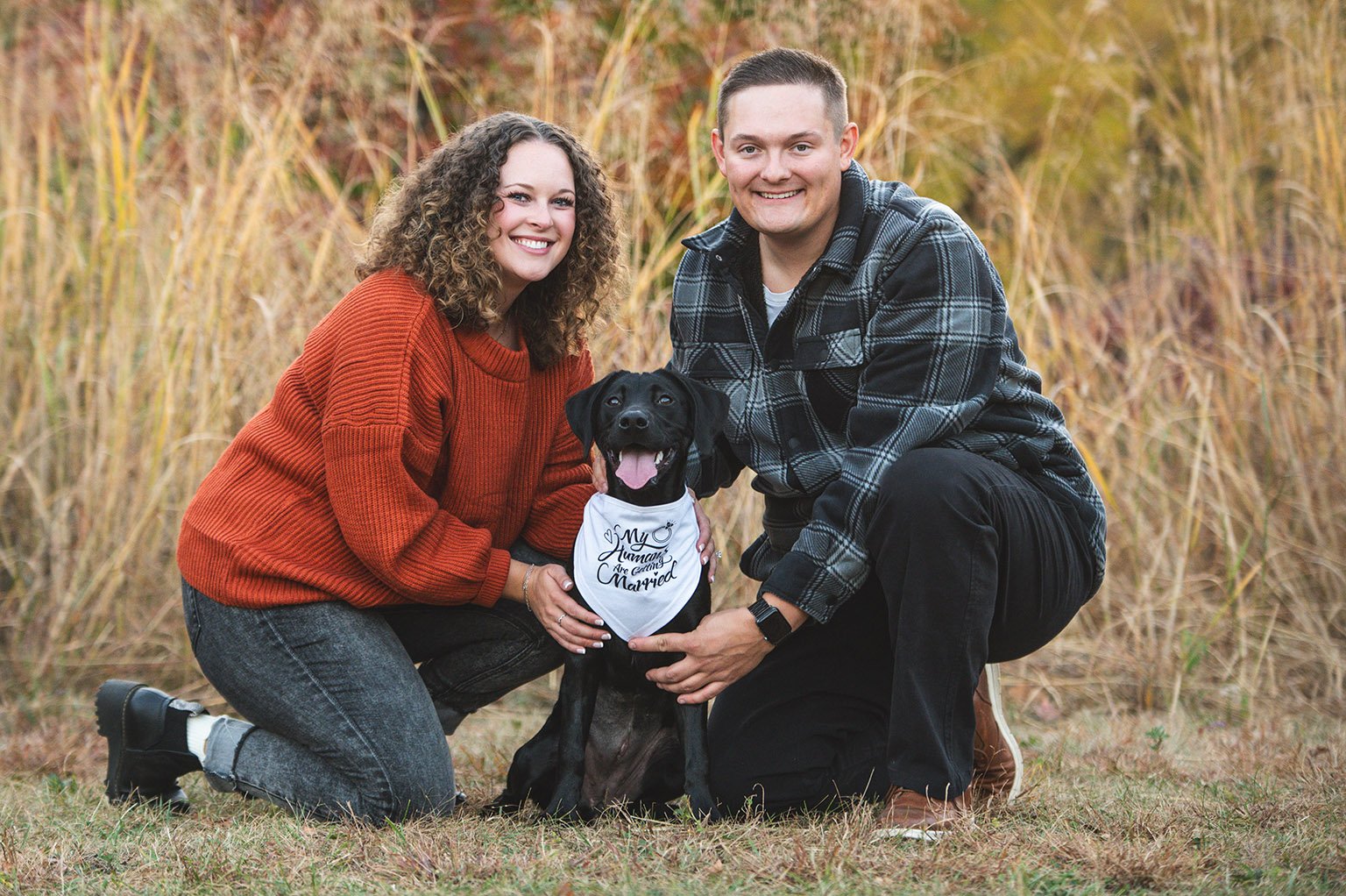 Fall engagement photos with couple and black lab at Jeffers Pond, in Prior Lake, Minnesota.