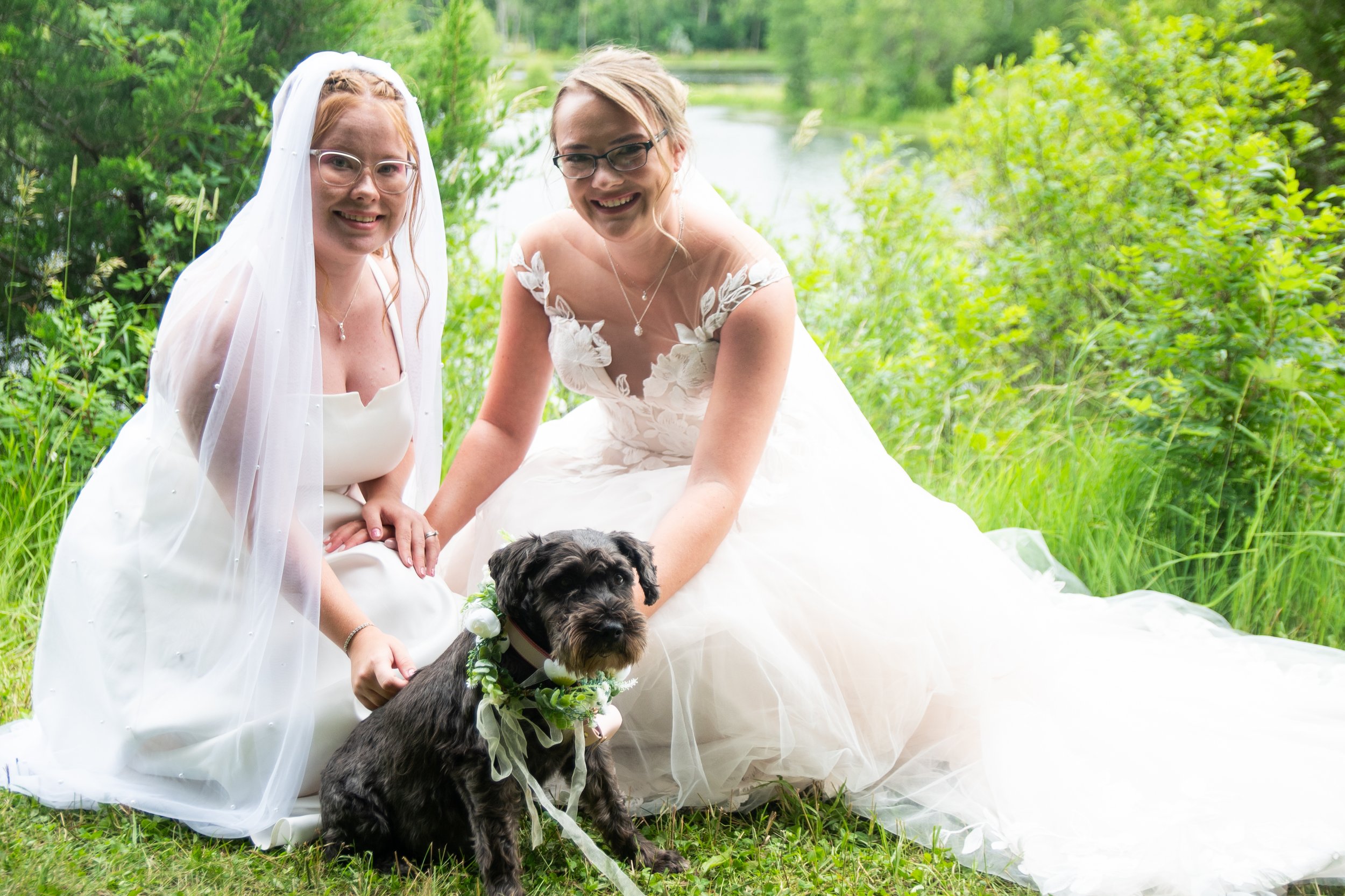 Minnesota couple with their dog on their wedding day surrounded by nature.