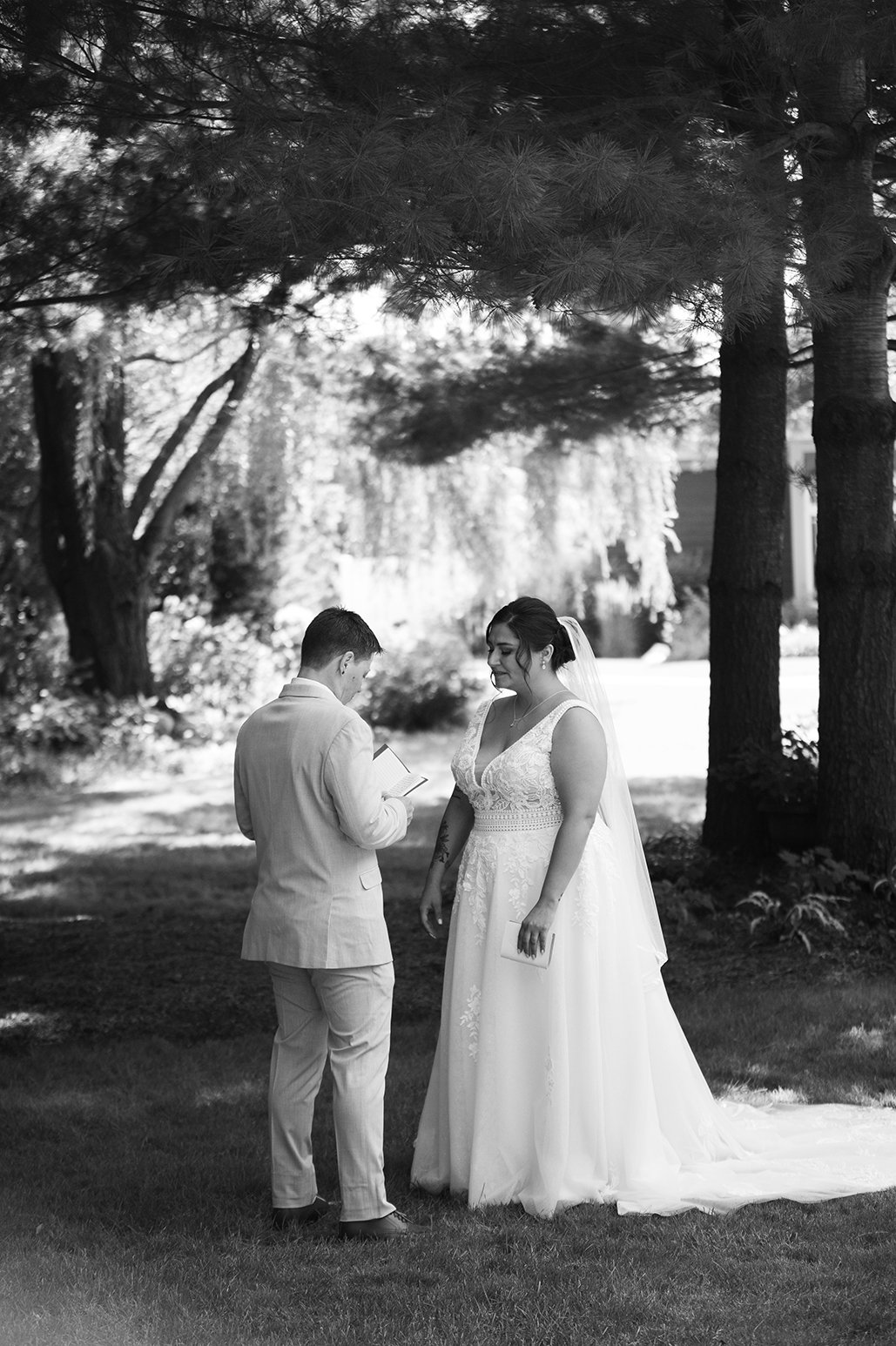 First looks with couple on their wedding day outside in Eau Claire, Wisconsin.