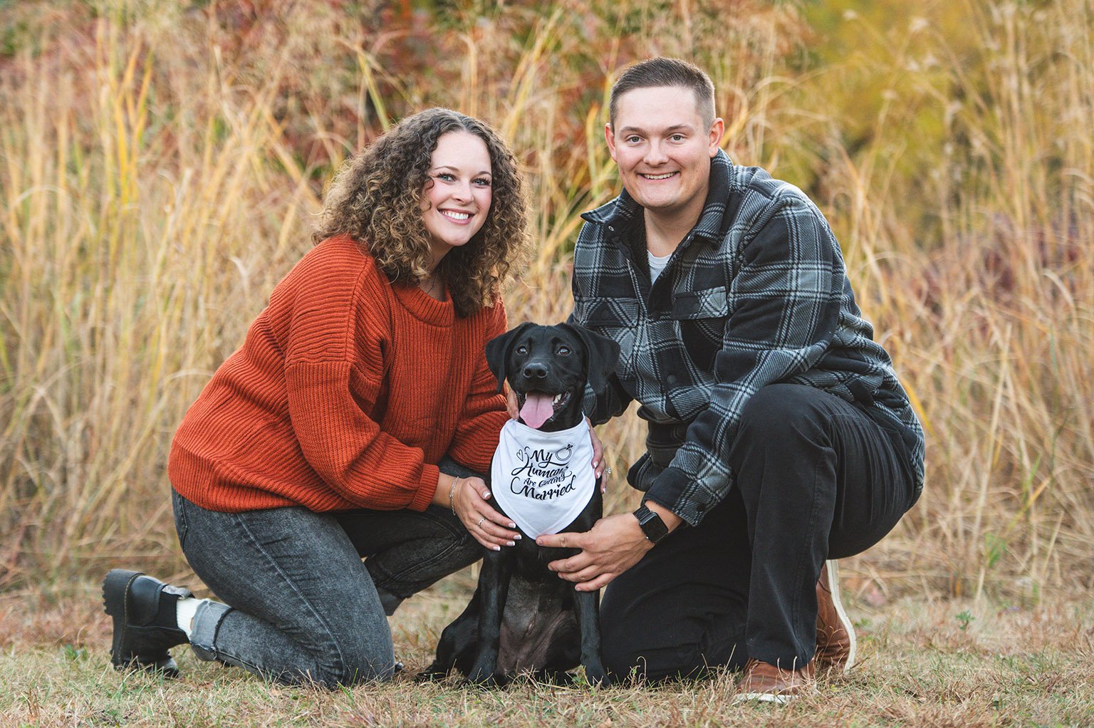 Fall engagement photos with couple and black lab at Jeffers Pond, in Prior Lake, Minnesota.