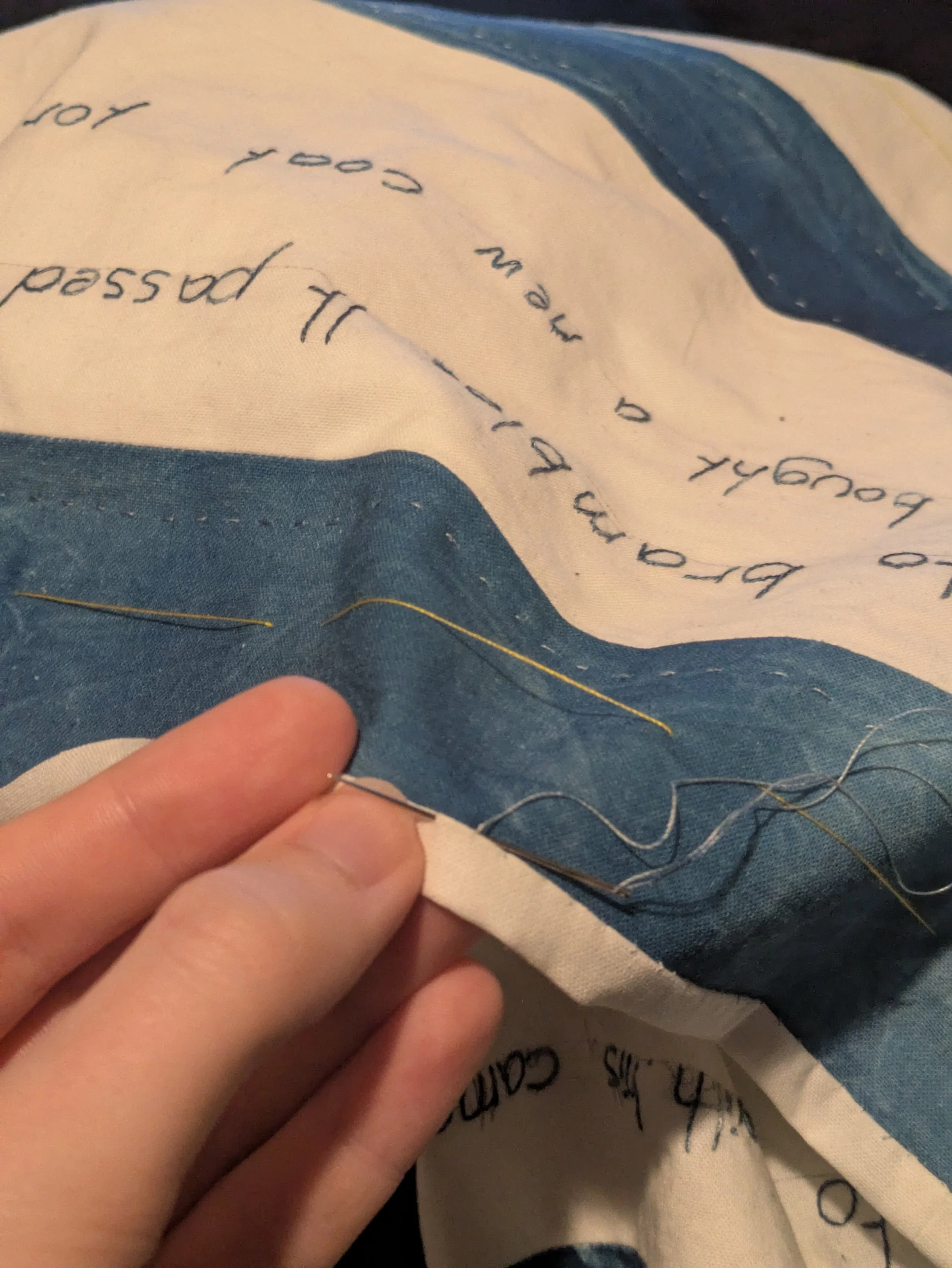 Rather than use a separate binding I trimmed and turned the backing fabric to the front and hand stitched it down.