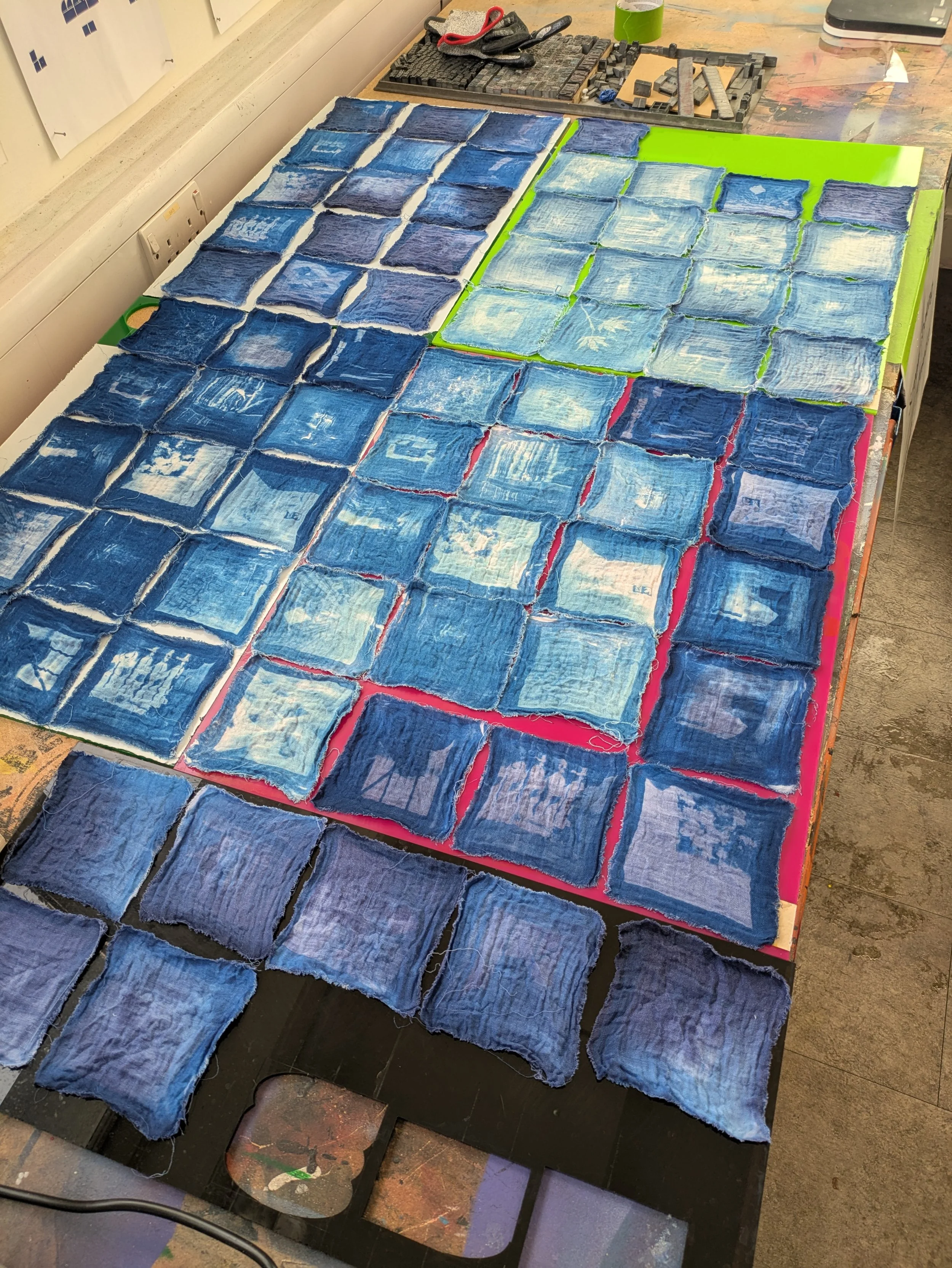 Testing exposure times and wash out method for cyanotype on fabric. All unsuccessful exposures were used in the final quilt to avoid wastage.  