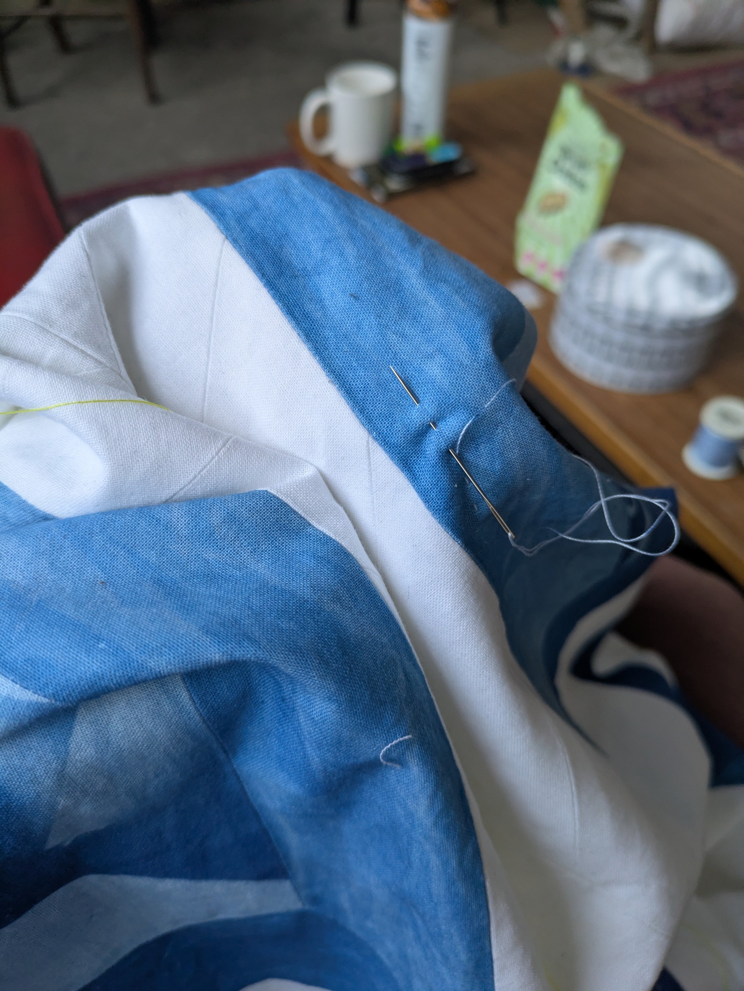 I used a lighter cyanotype thread in the quilting both to provide contrast to the text and to allow it to be more visible on the blue of the cyanotyped pieces. 