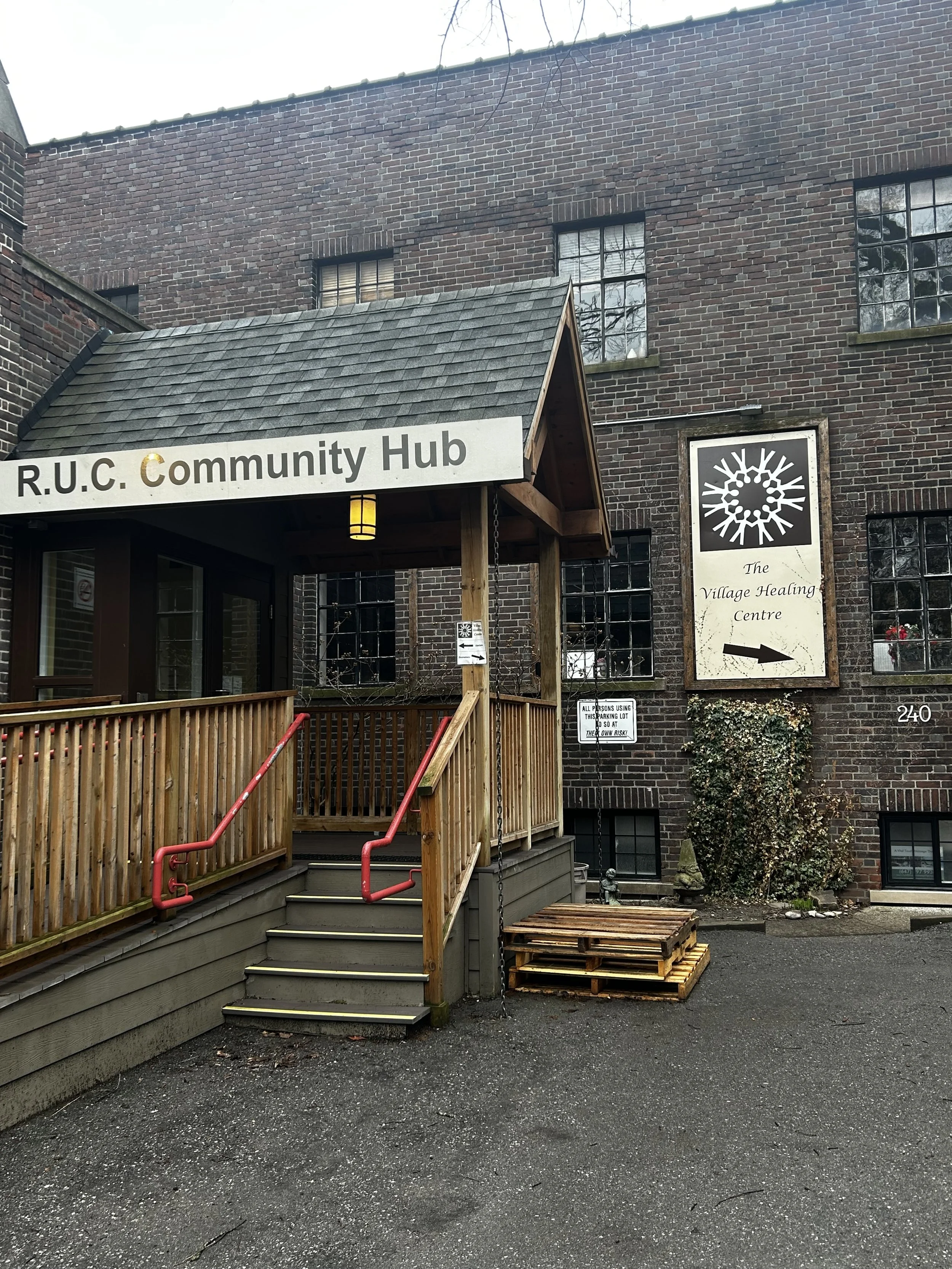 Outside of a building where the healing village centre is located