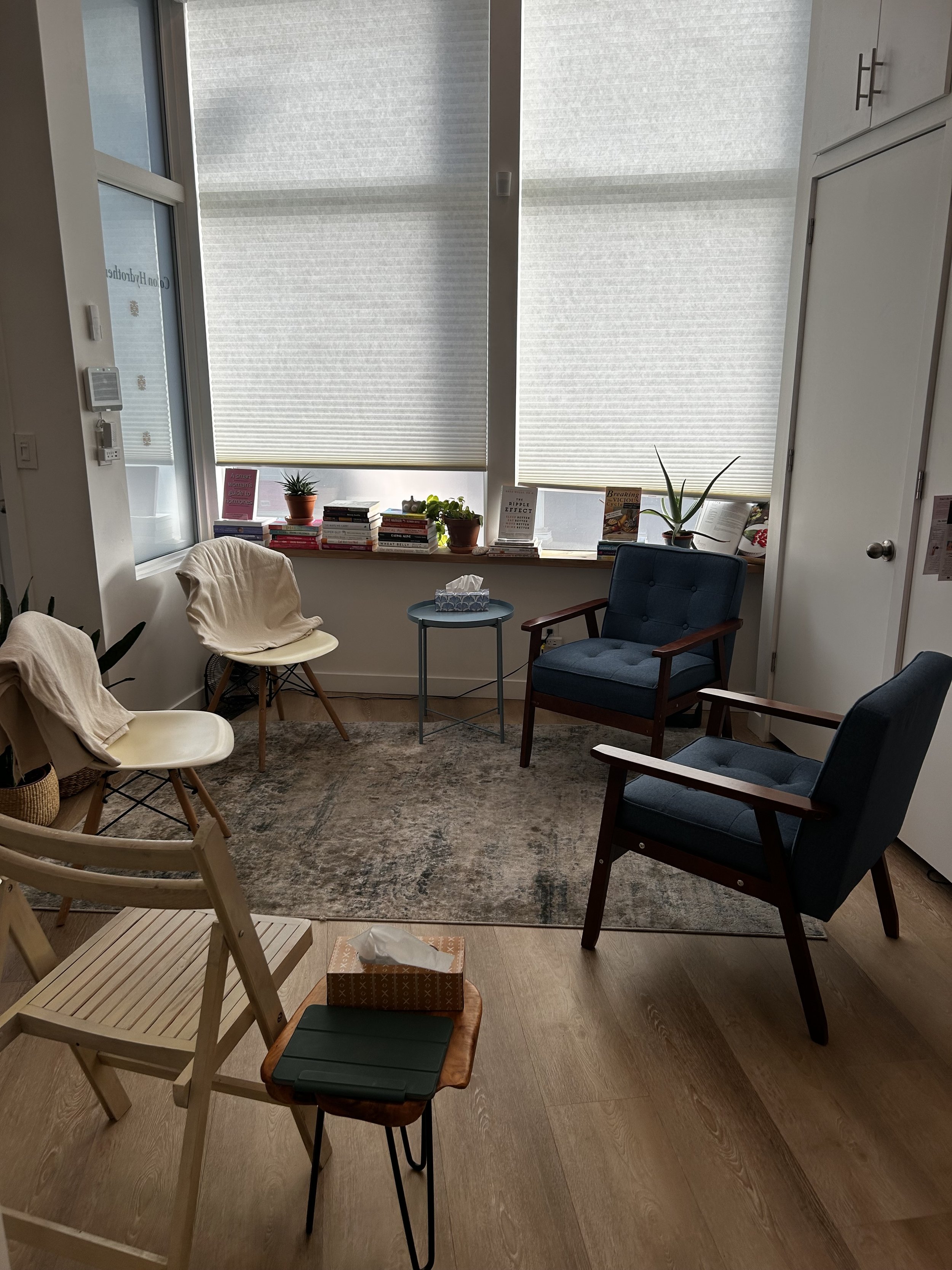 Calm therapy room at Interocare's Junction office inside Women's Health Collaborative, with reading nook and seating