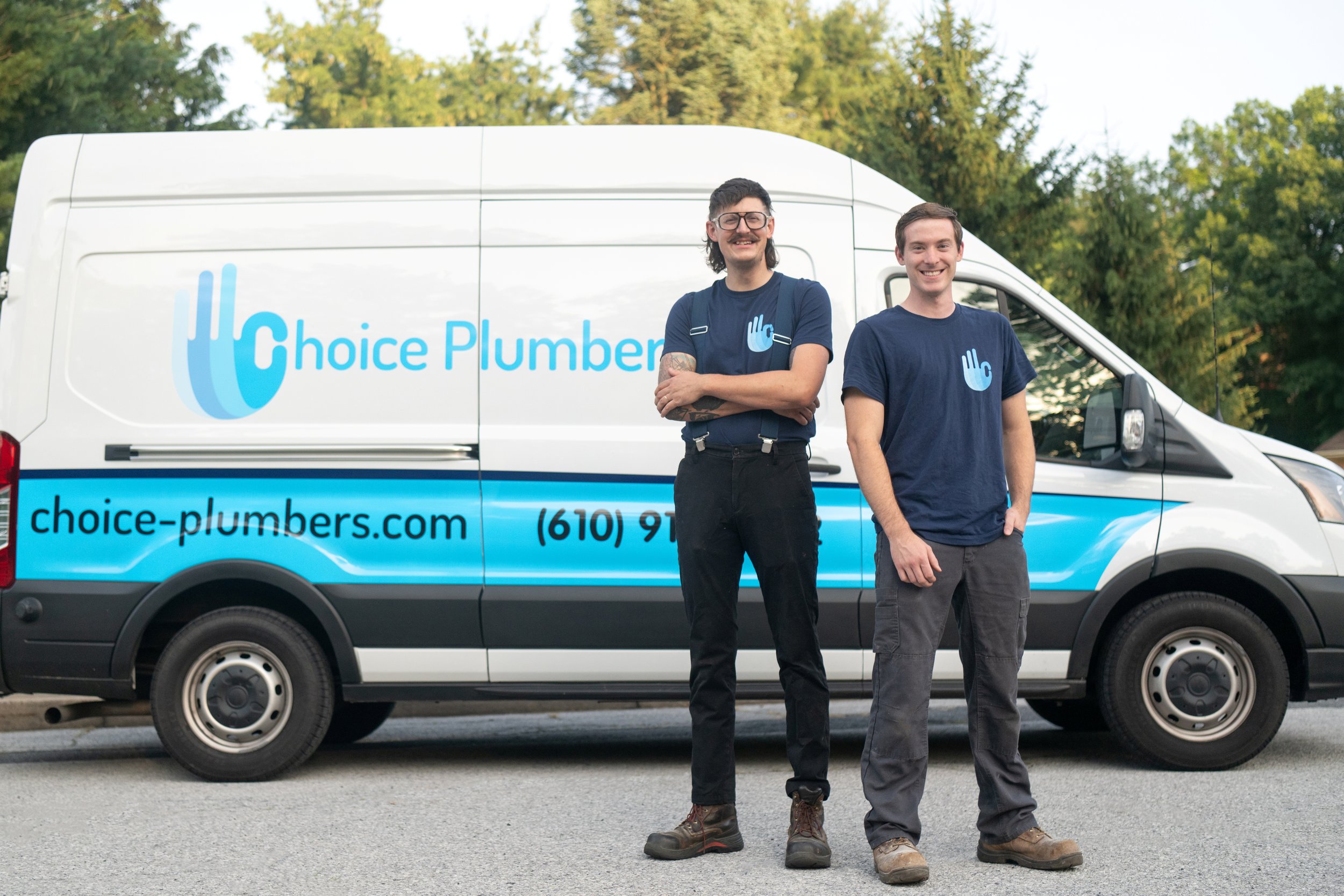 Owners of Choice Plumbing in front of Choice Plumber VAn