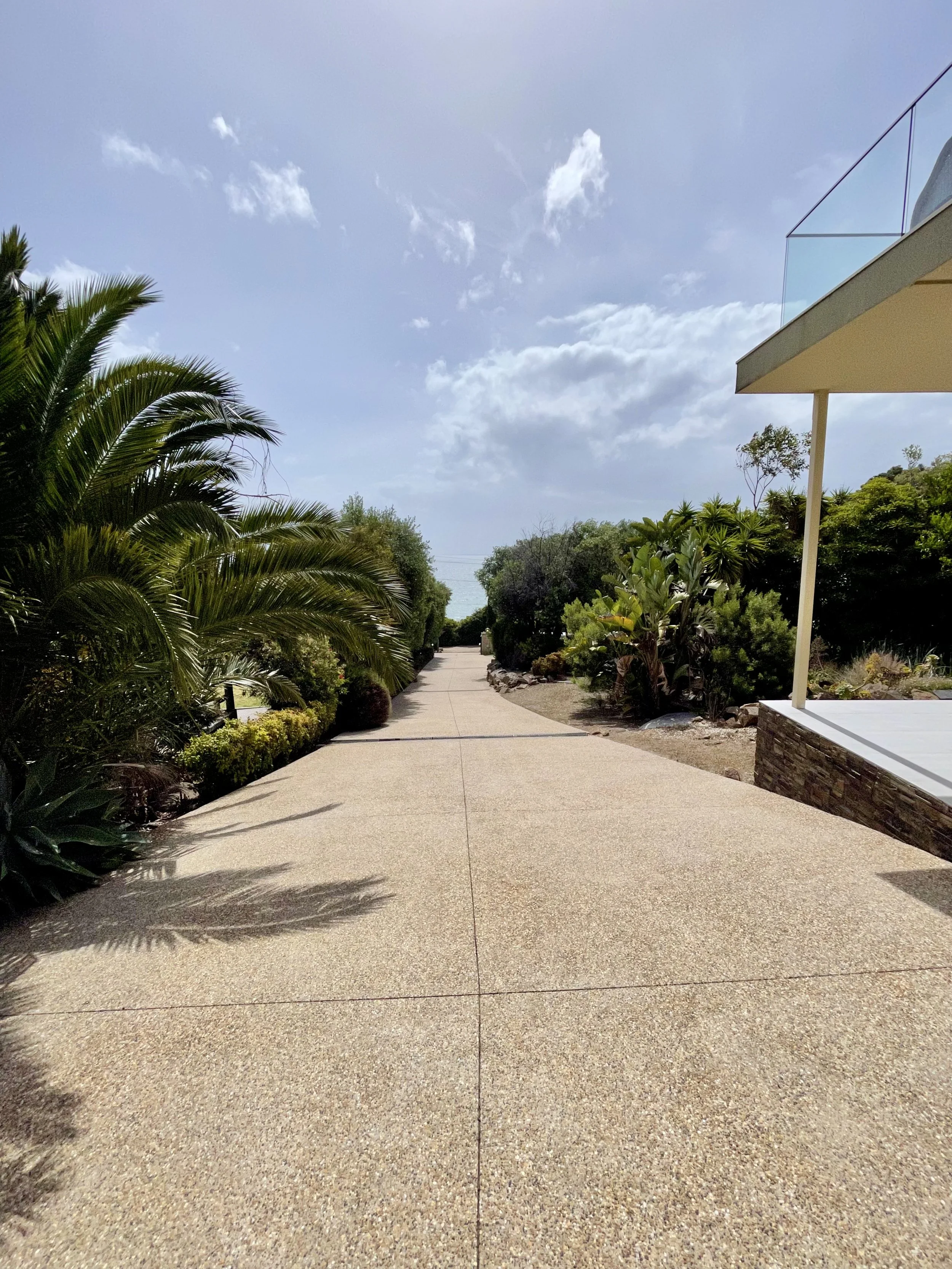 Concrete driveway pressure washing coastal property Melbourne — SUDS Group exterior cleaning specialists
