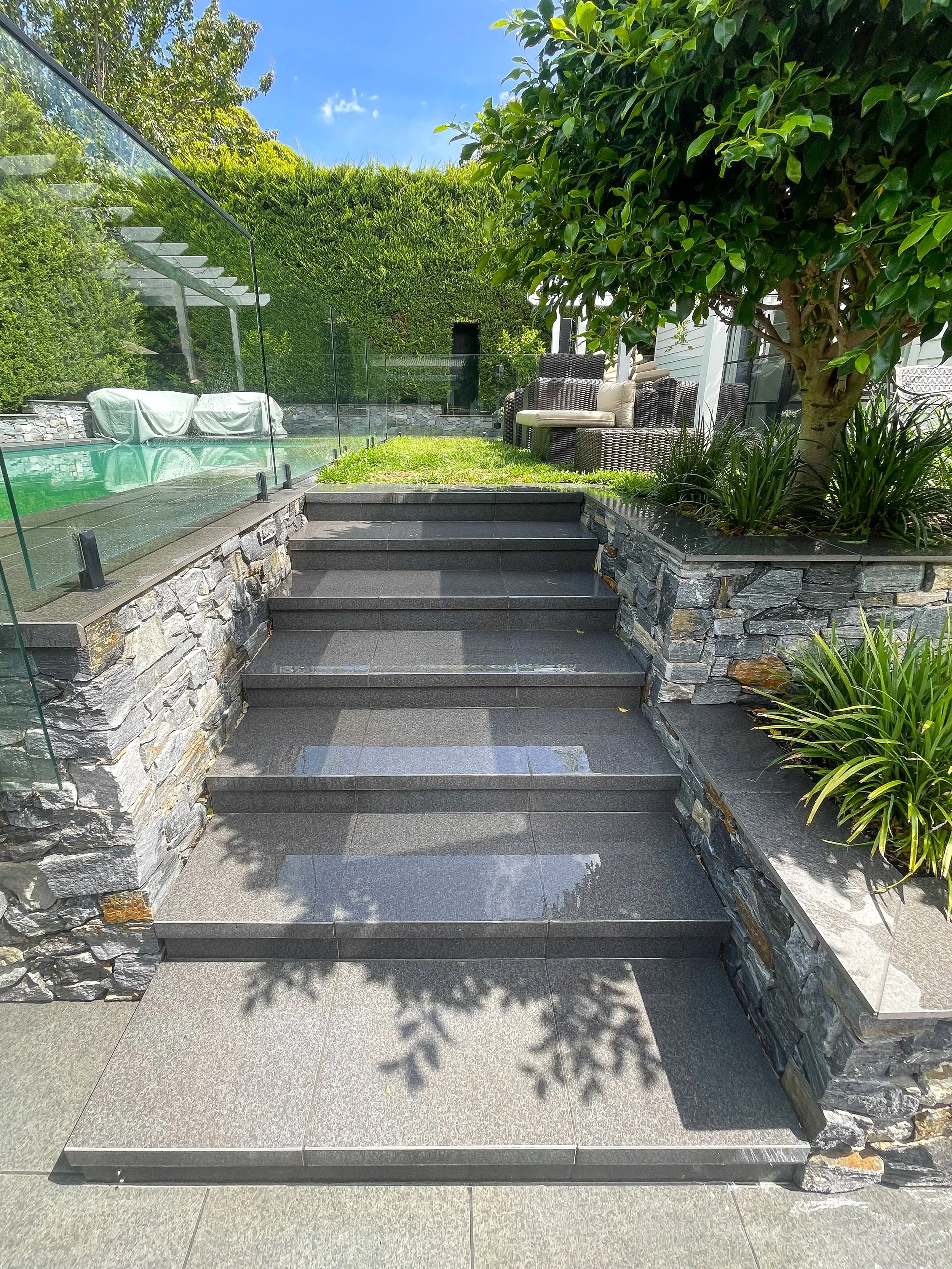 Granite steps and pool surround pressure washing luxury residential Melbourne — SUDS Group