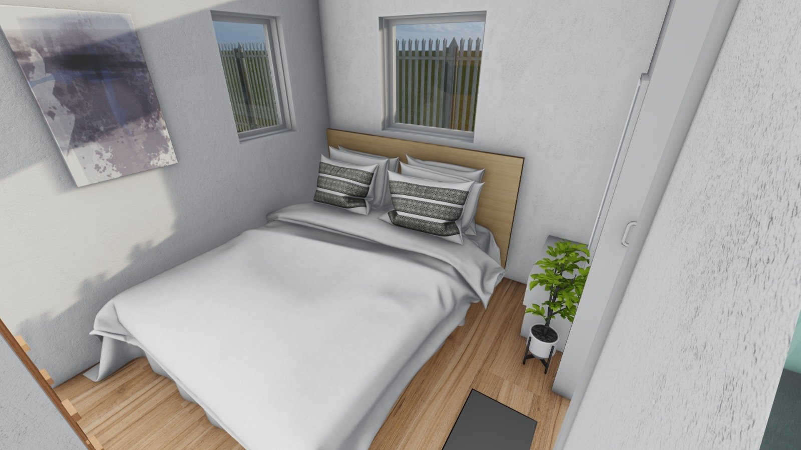 A neatly made bed with five pillows against a light wood headboard in a small bedroom with two windows, a potted plant, and a piece of abstract wall art.