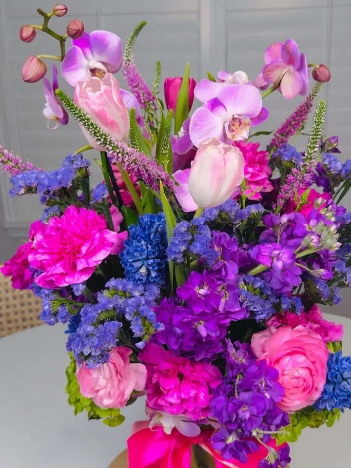 Pretty Pinks &amp; Purples! #winterparkflorist #pinksandpurples #orchids #tulips #ranunculus