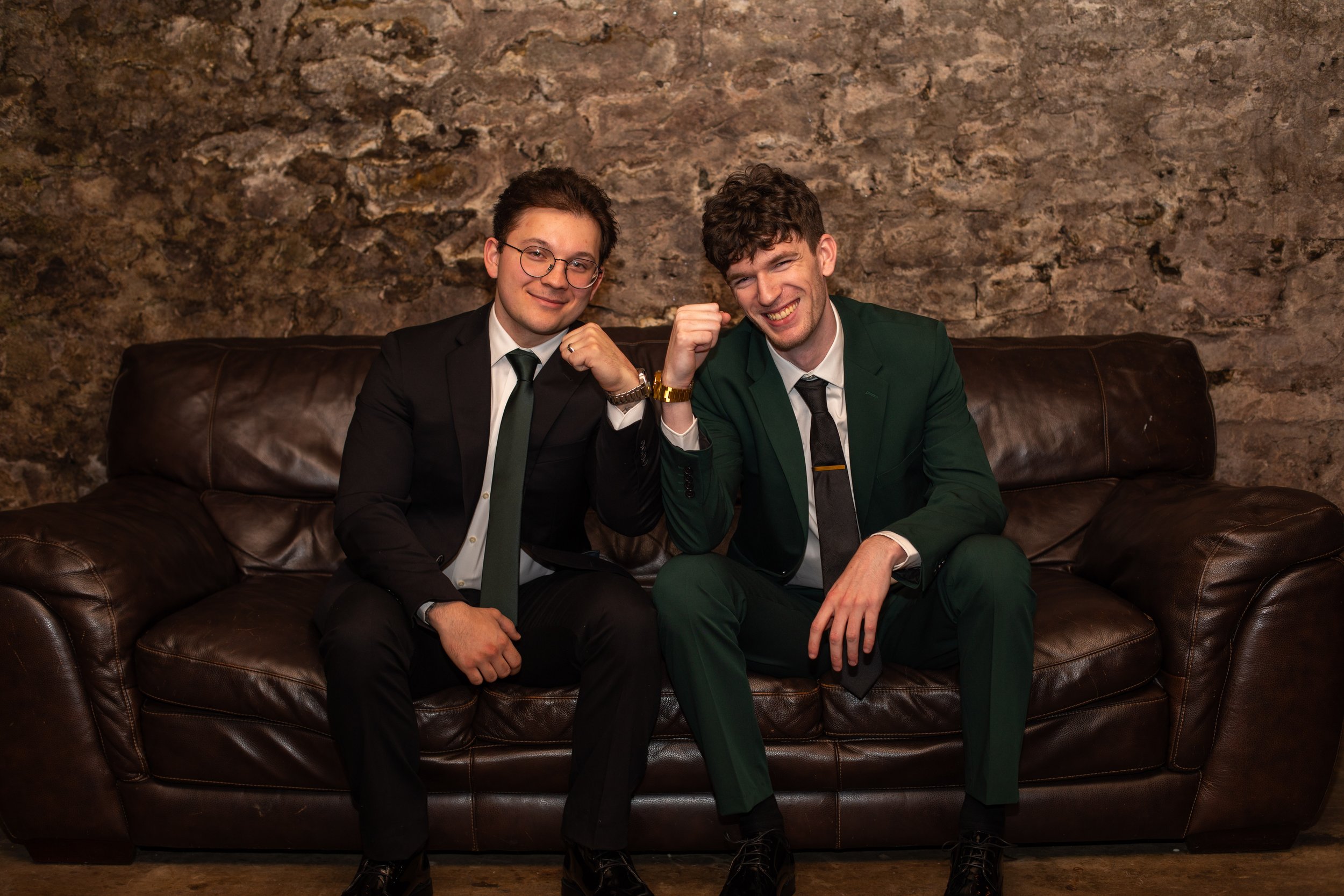 Groomsman/groom on a couch