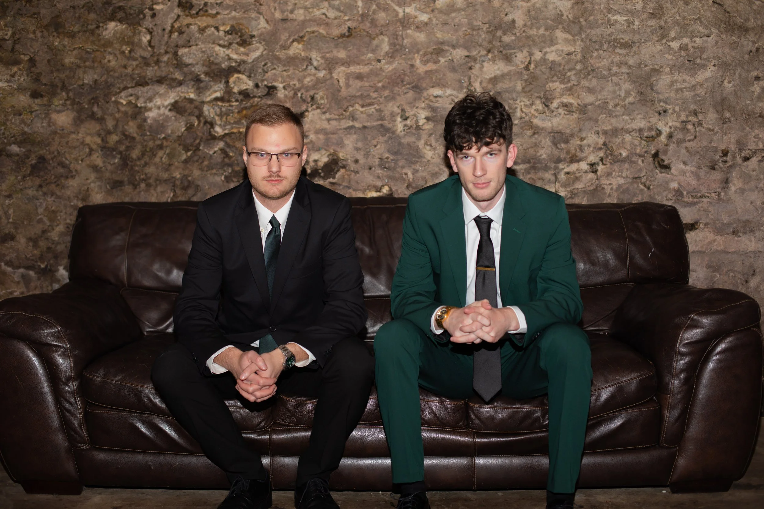 Groomsman/groom on a couch