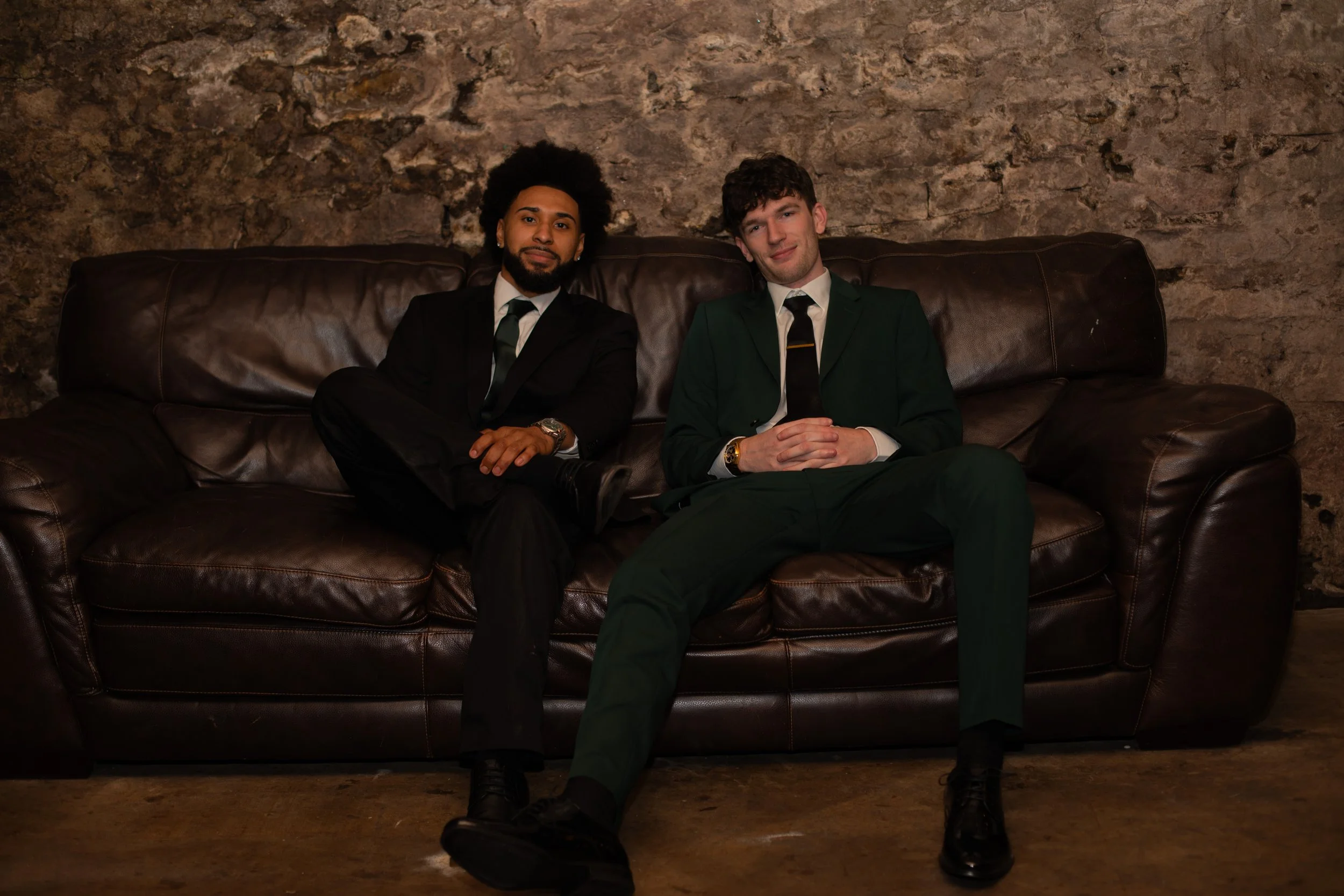 Groomsman/groom on a couch