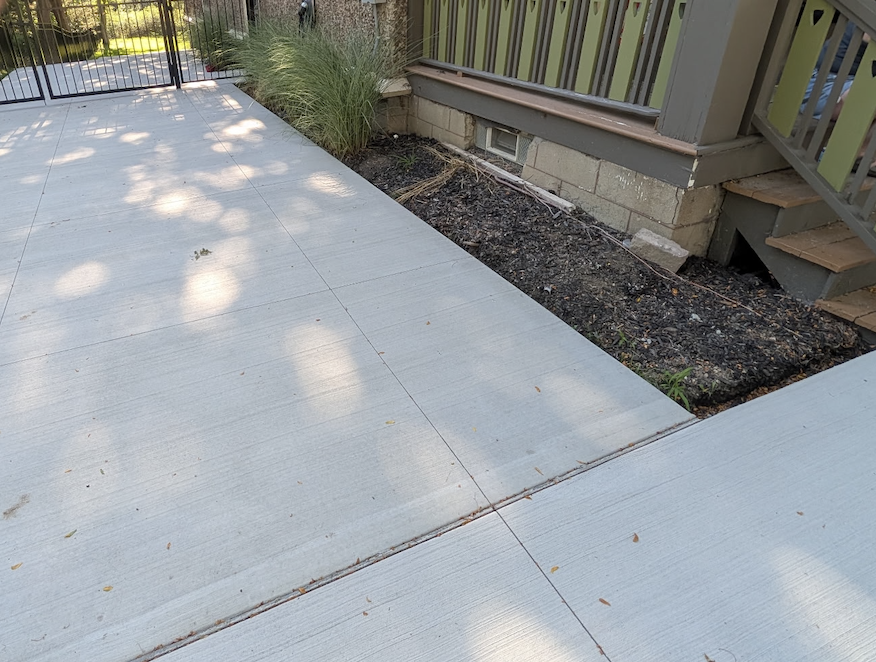 Landscape bed renovation alongside residential walkway by Kielty Landscaping in West Seneca NY