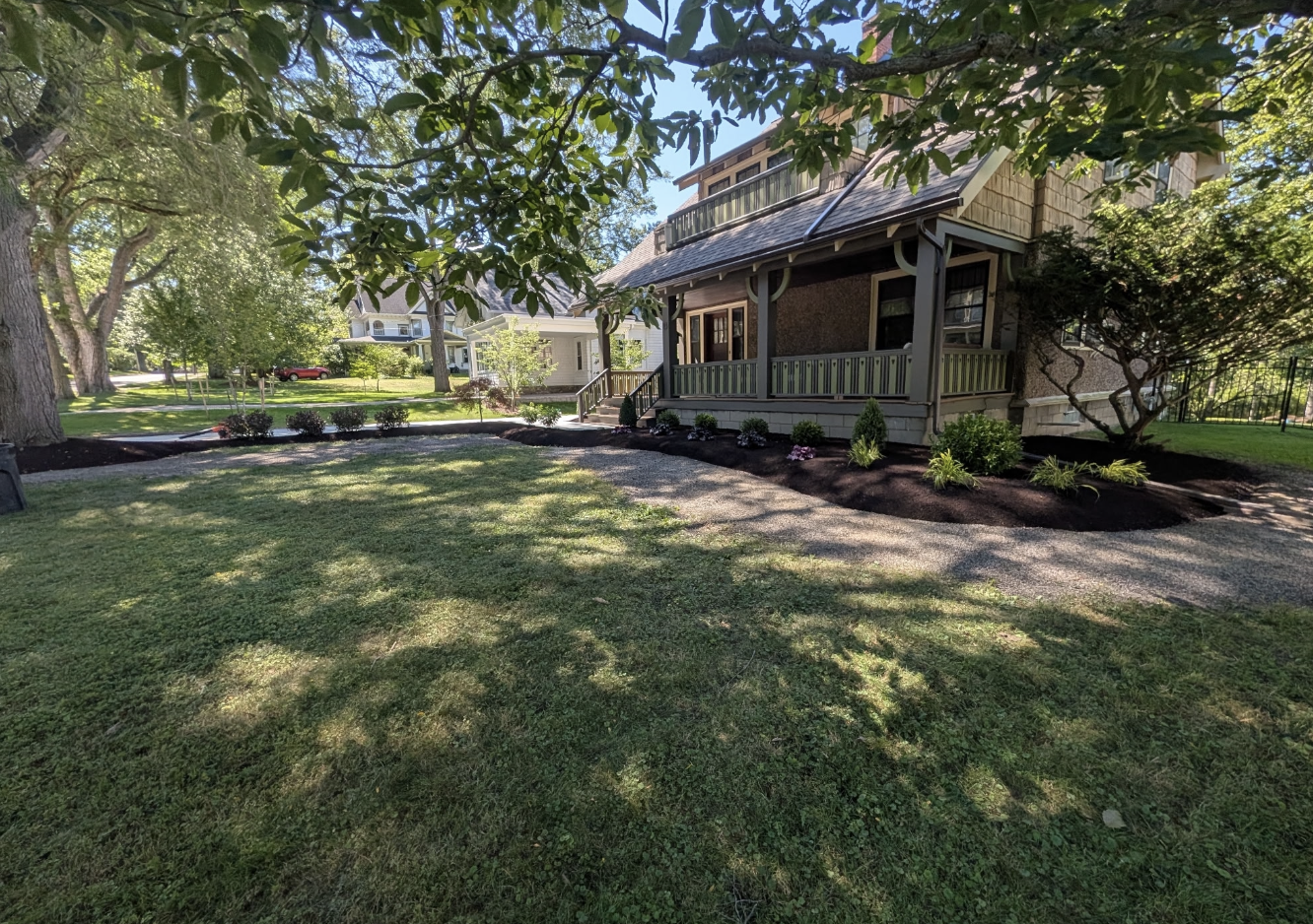 Finished landscape makeover and lawn restoration surrounding a residential property in West Seneca NY