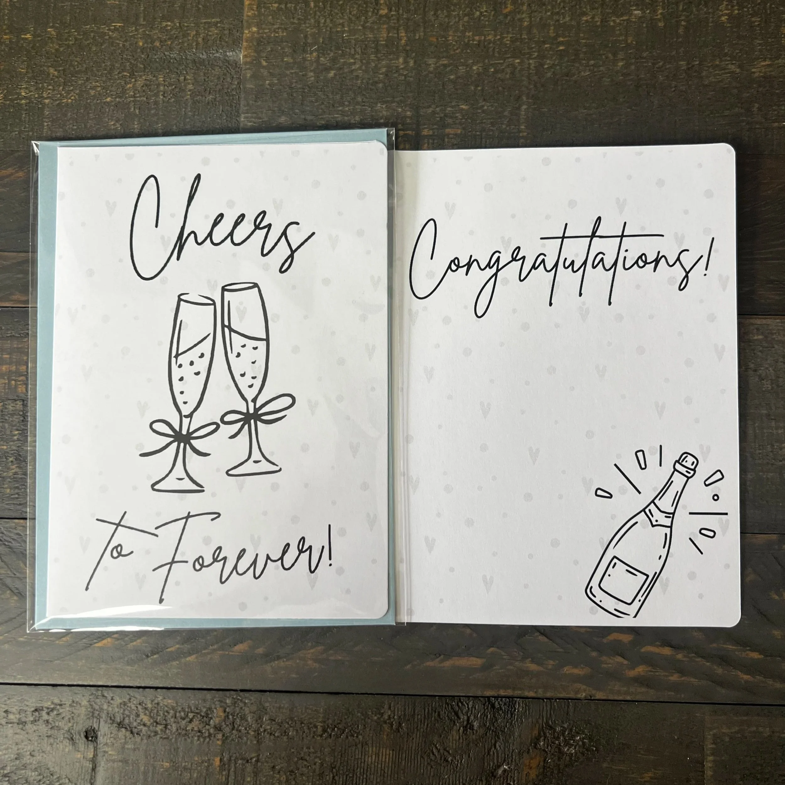 Front and inside of Cheers to Forever engagement card.