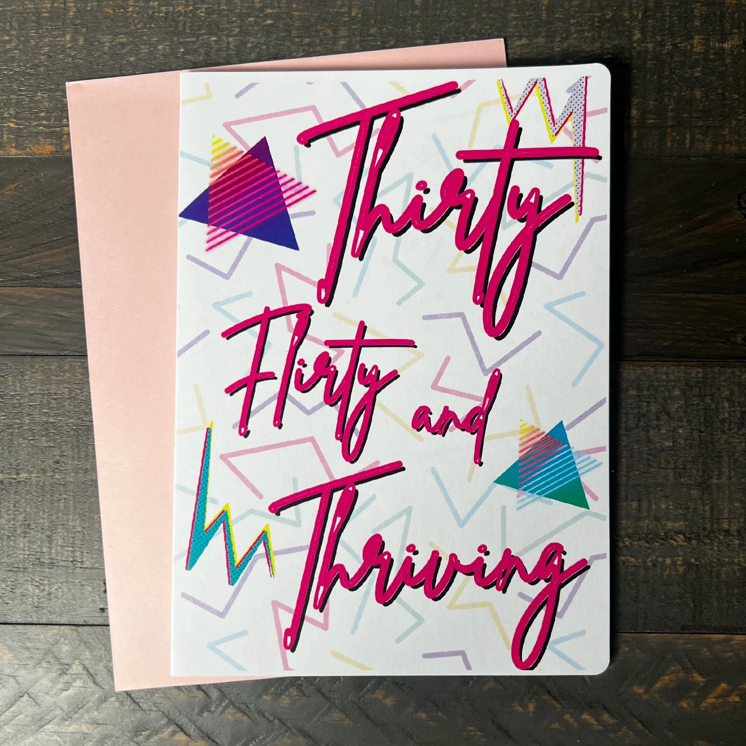 Front of Thirty, Flirty & Thriving birthday greeting card with coordinating pink envelope.