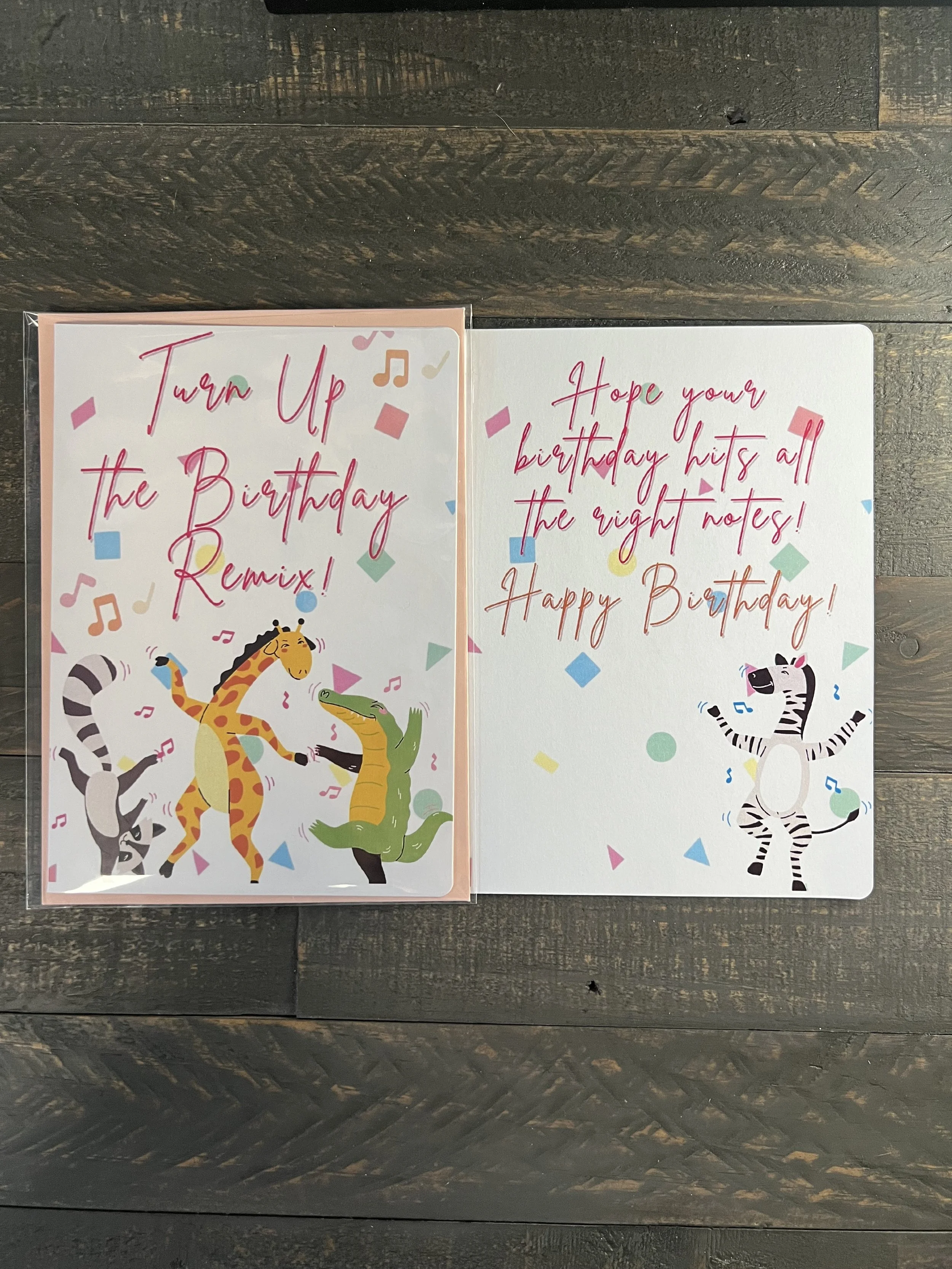 Open birthday card showing inside message “Hope your birthday hits all the right notes. Happy Birthday!”