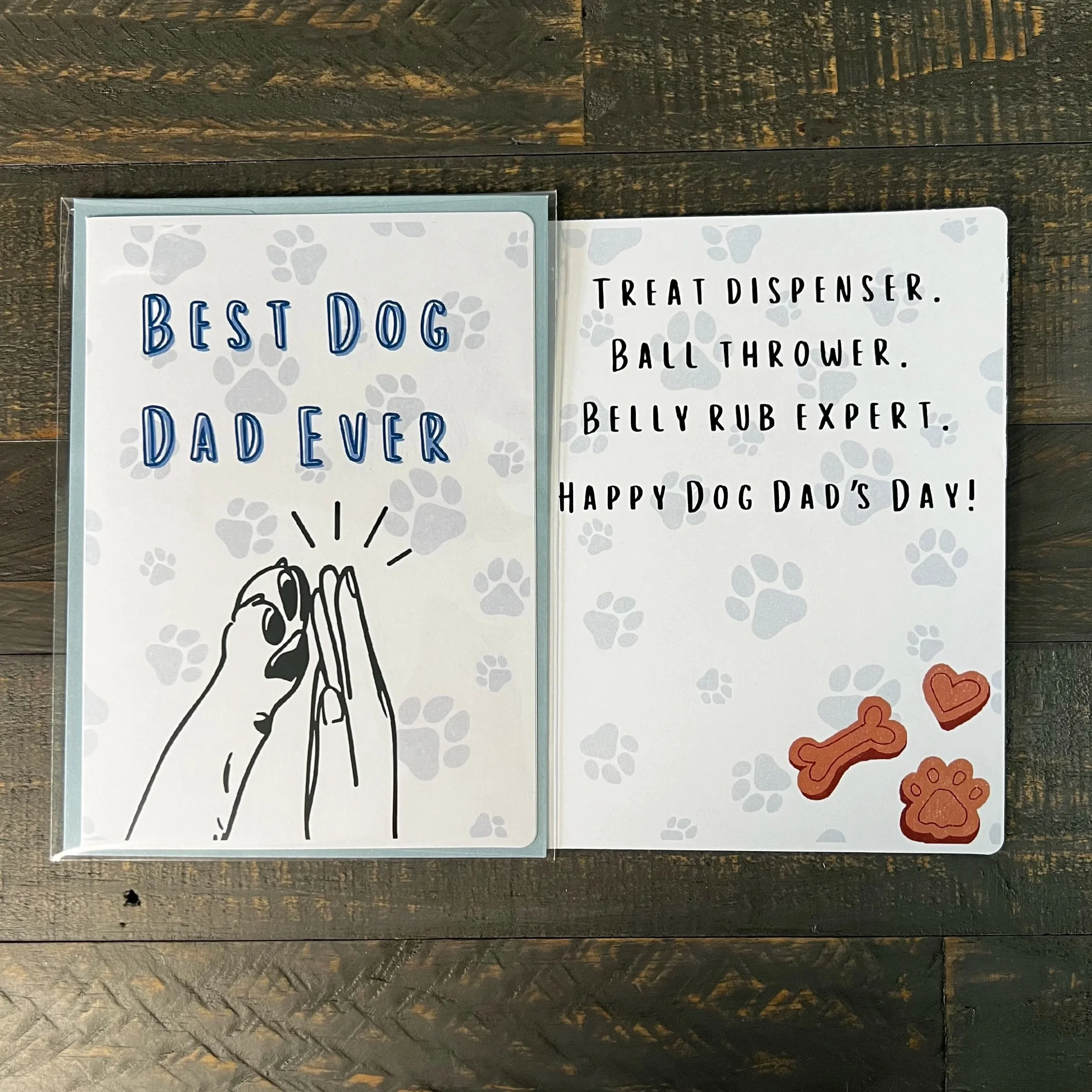 Dog-themed Father’s Day card displayed open with playful inside message visible