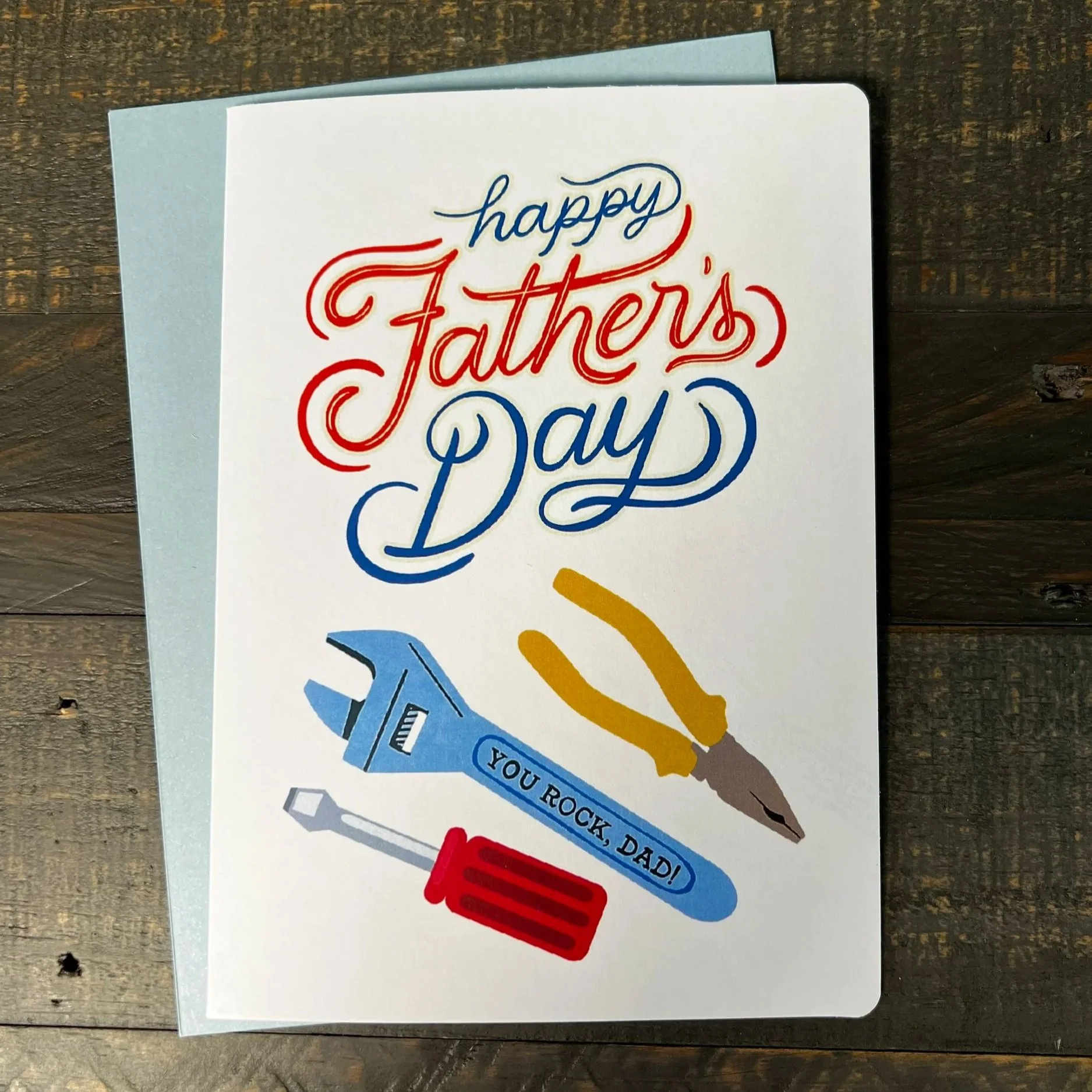 Father’s Day card with tool-themed design featuring pliers, wrench, and screwdriver illustrations