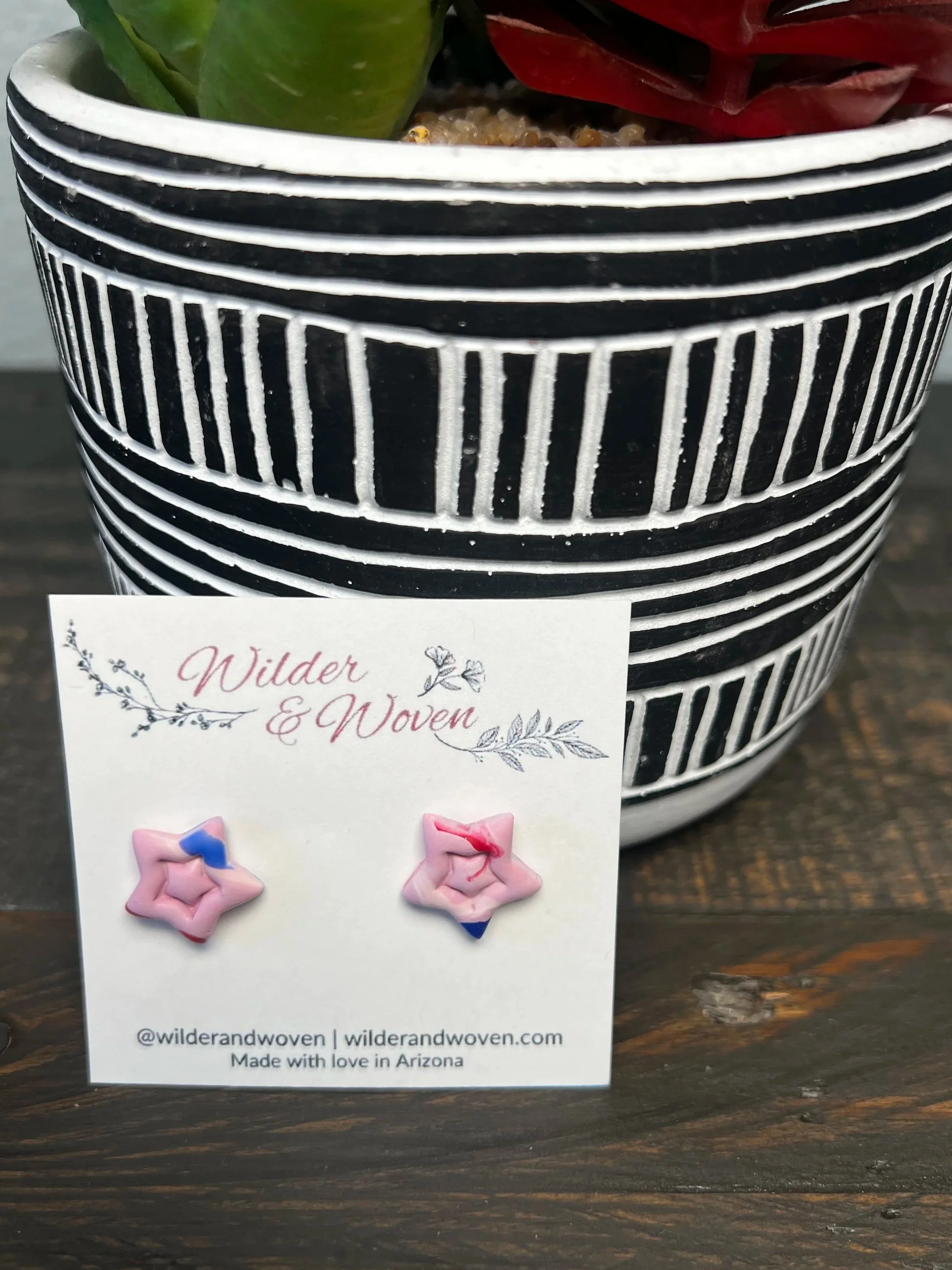 Handmade blush pink polymer clay star stud earrings displayed on a Wilder & Woven earring card.