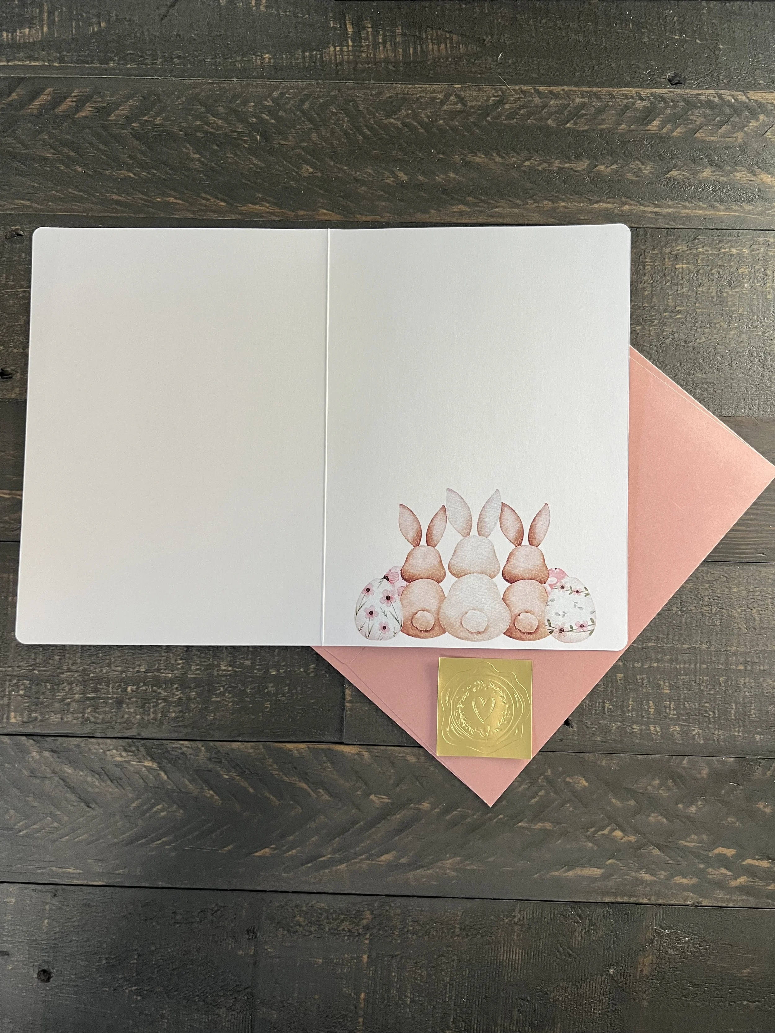 Inside of Easter card with blank space for personalized message and floral detail in corner