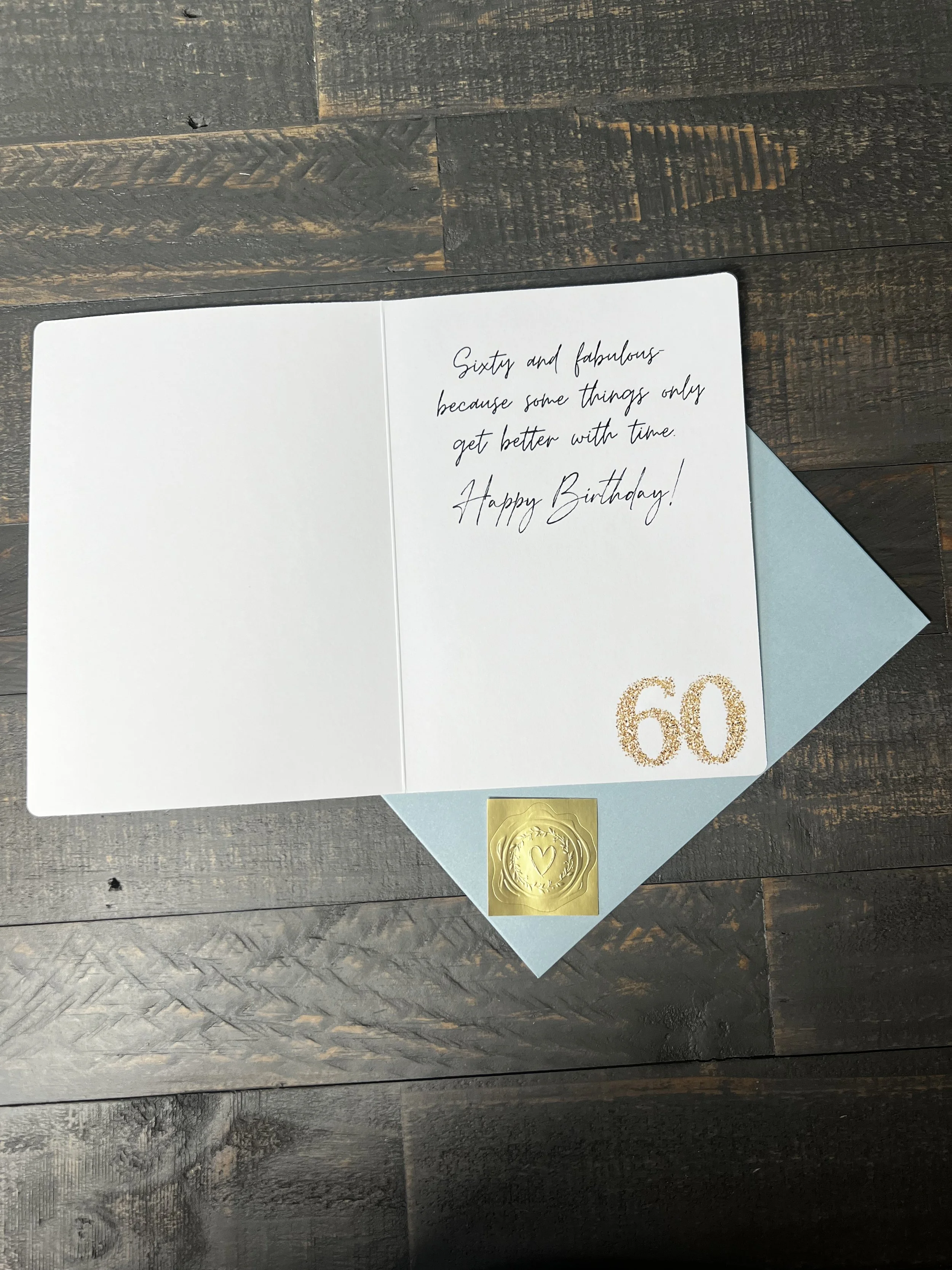 Open Sixty & Fabulous greeting card with coordinating envelope and gold wax seal style sticker.