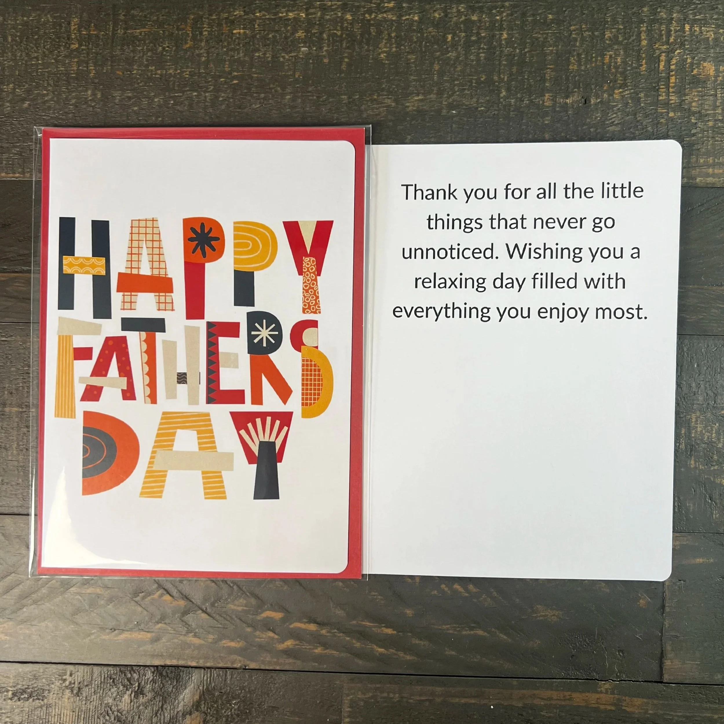 Father’s Day card displayed open with heartfelt inside message visible beside colorful cover