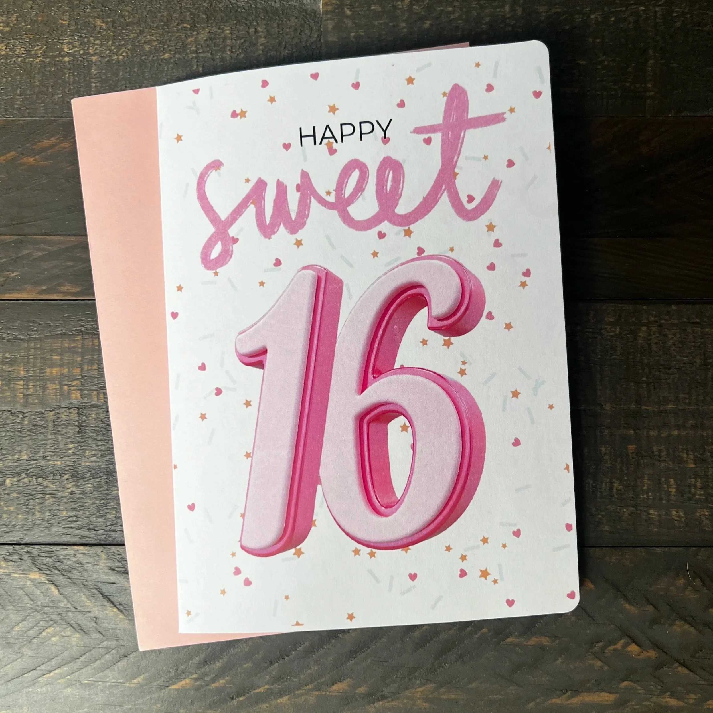 Front of Sweet 16 birthday greeting card with coordinating pink envelope.