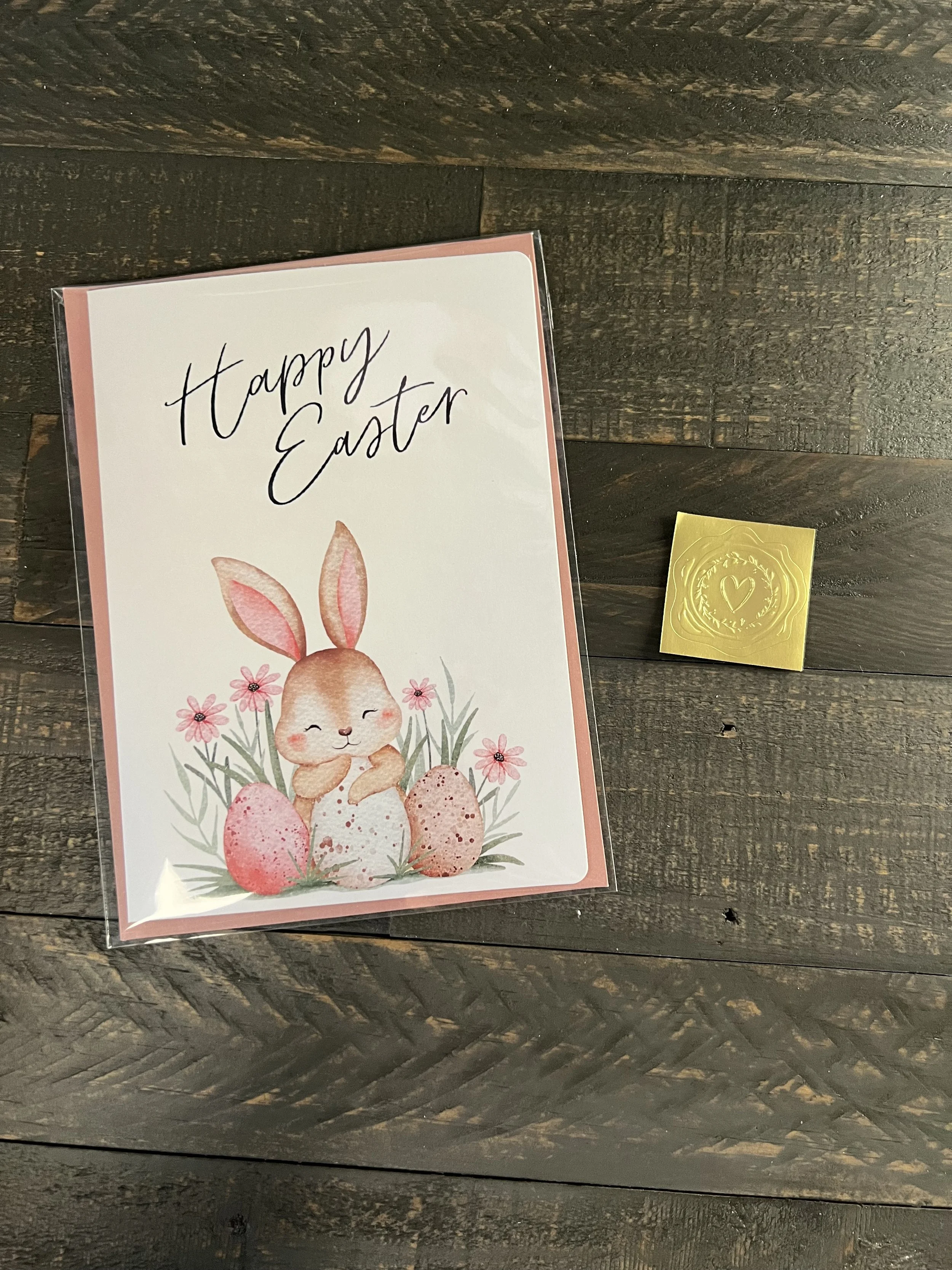 Easter bunny card with coordinating envelope and gold wax seal sticker styled on wood surface