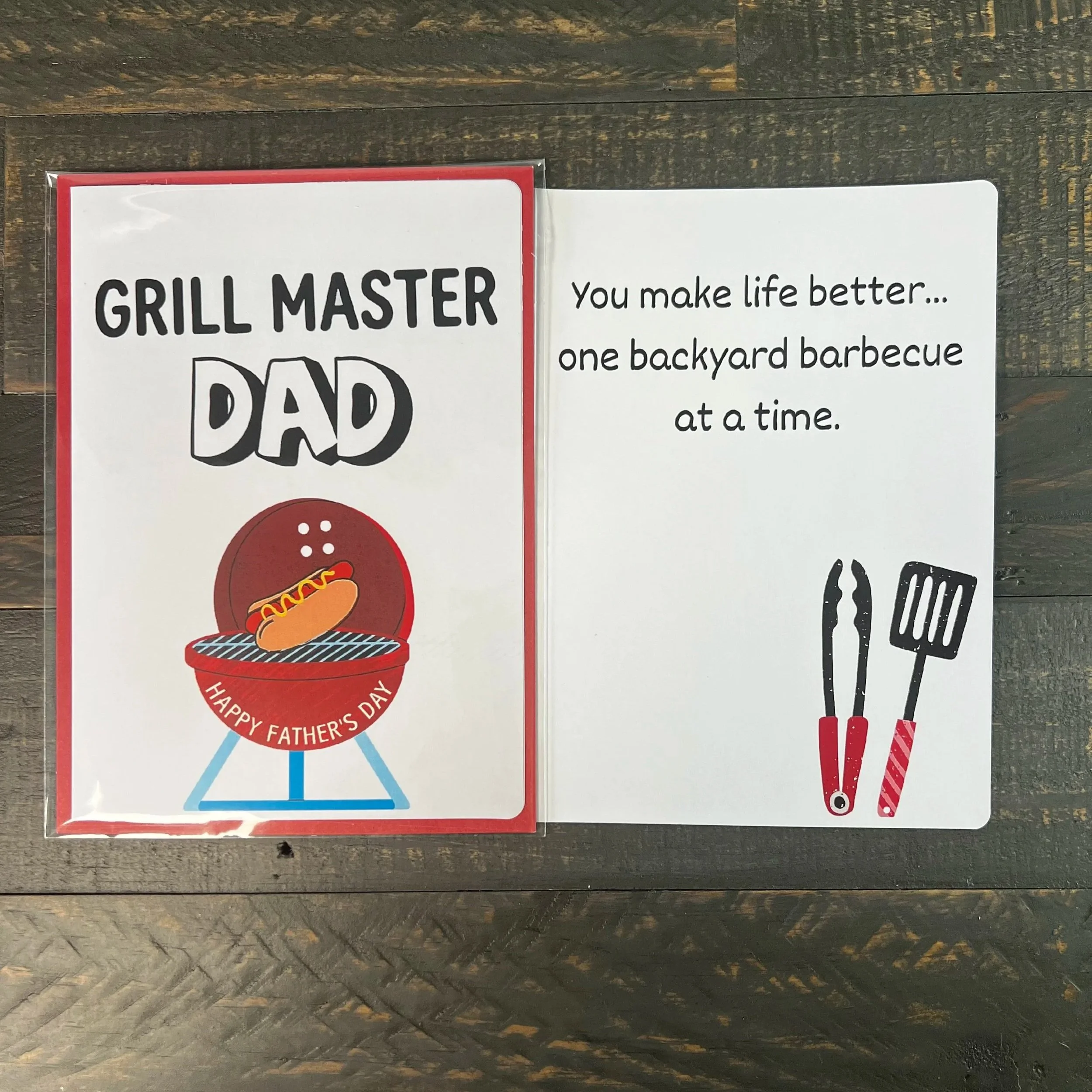 Father’s Day card displayed open with grill-themed cover and heartfelt inside message visible