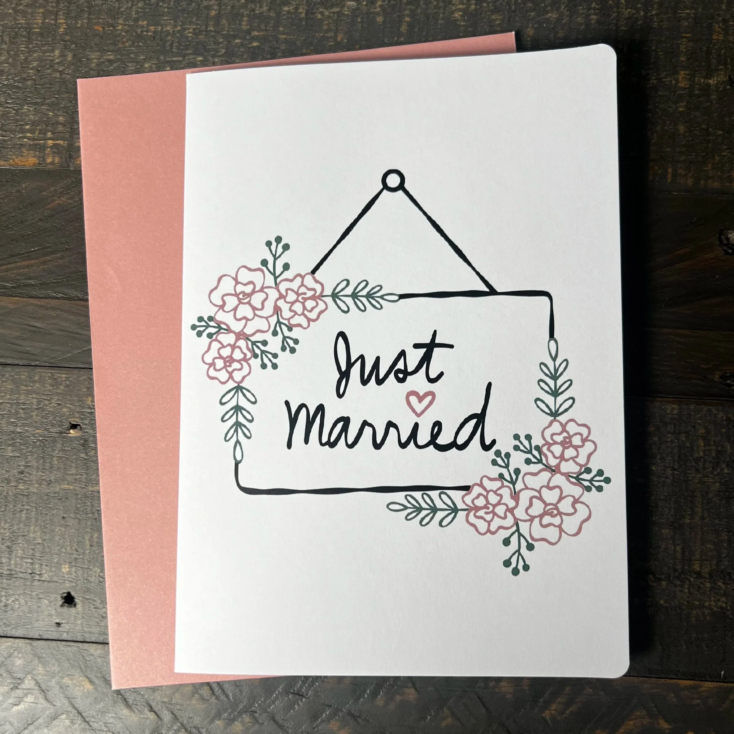 Front of Just Married Wedding Card with coordinating blush pink envelope.