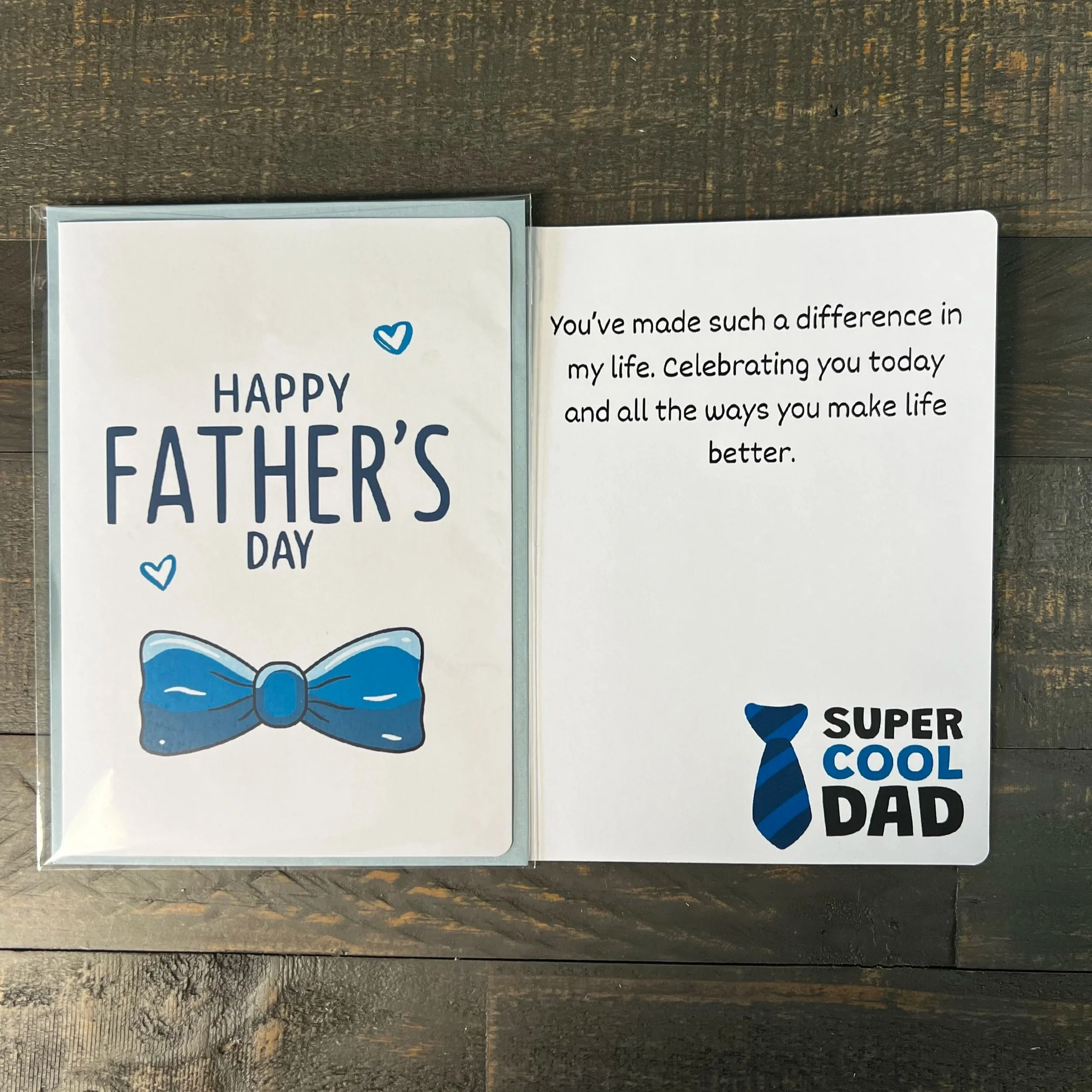 Father’s Day greeting card displayed open with heartfelt inside message and blue bow tie cover visible