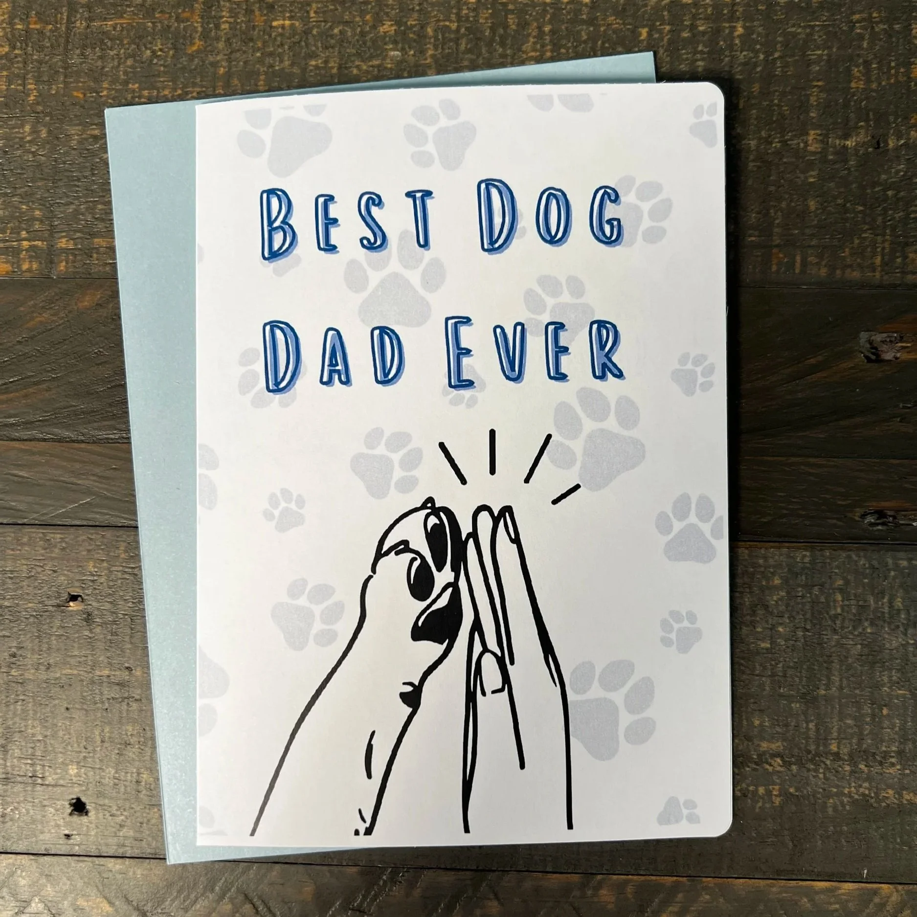 Dog dad Father’s Day card with paw print details and dog high-five illustration