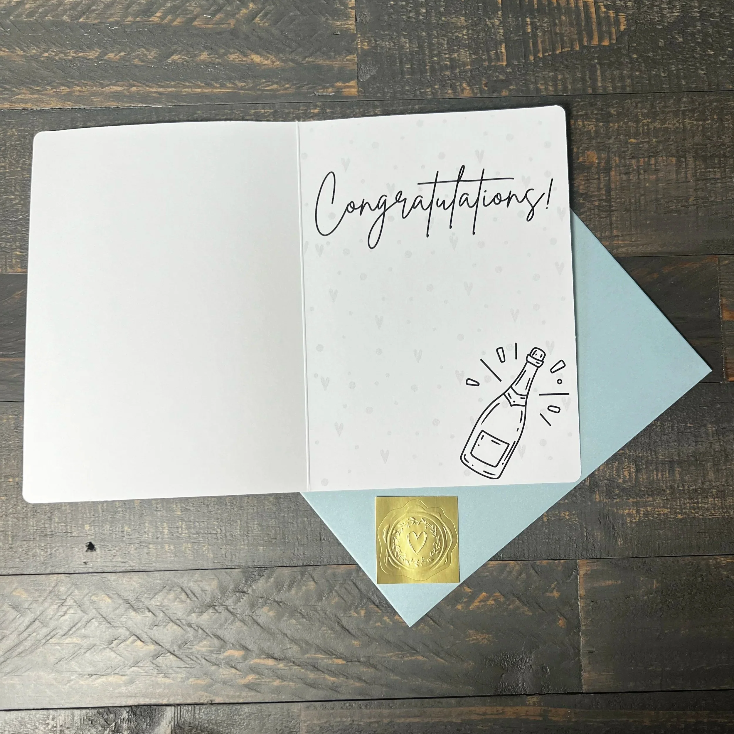 Open Cheers to Forever engagement card showing the congratulations message.