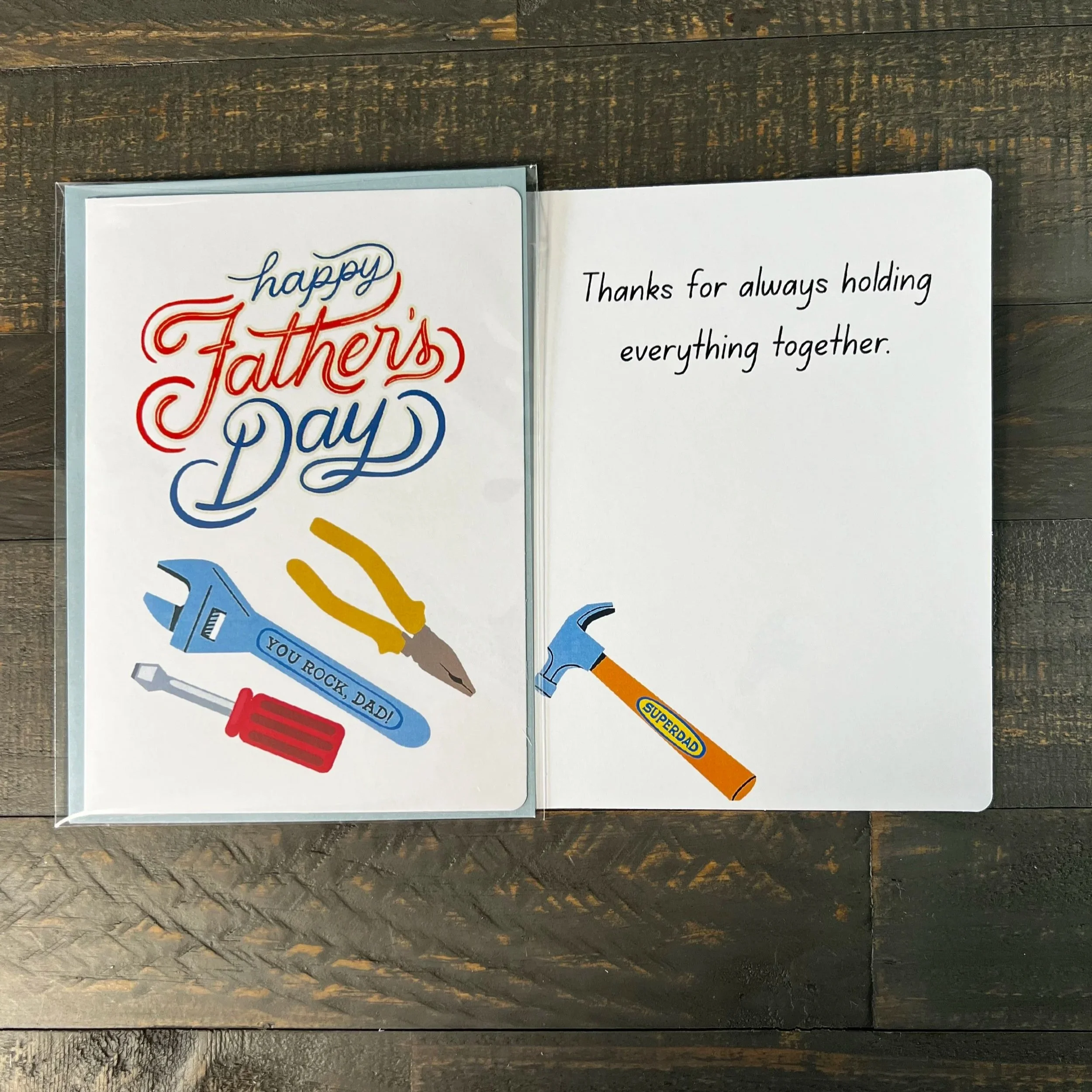 Tool-themed Father’s Day card displayed open with heartfelt inside message visible