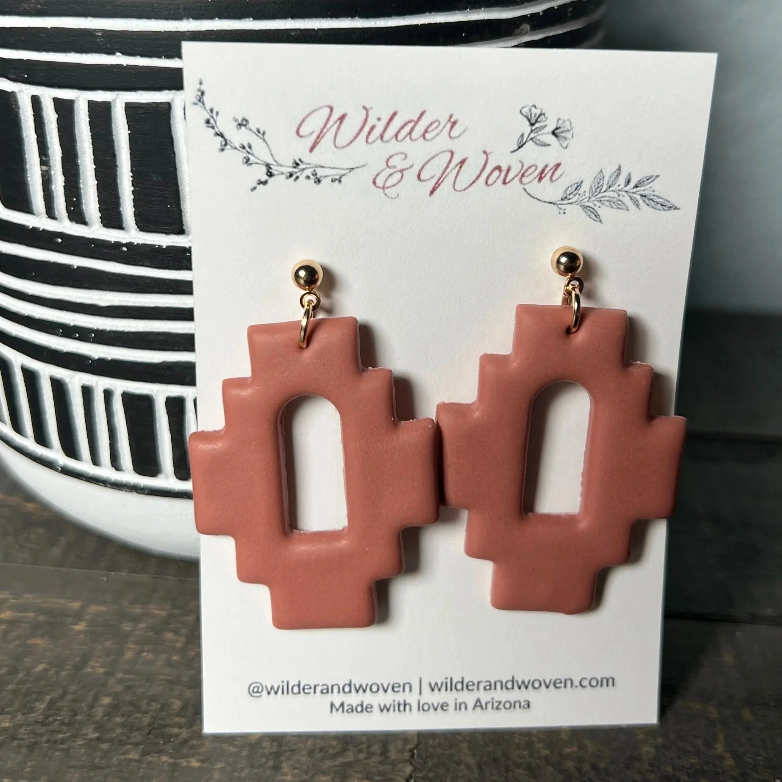 Handcrafted polymer clay geometric statement earrings in a warm Sedona clay tone, displayed on a Wilder & Woven branded jewelry card.