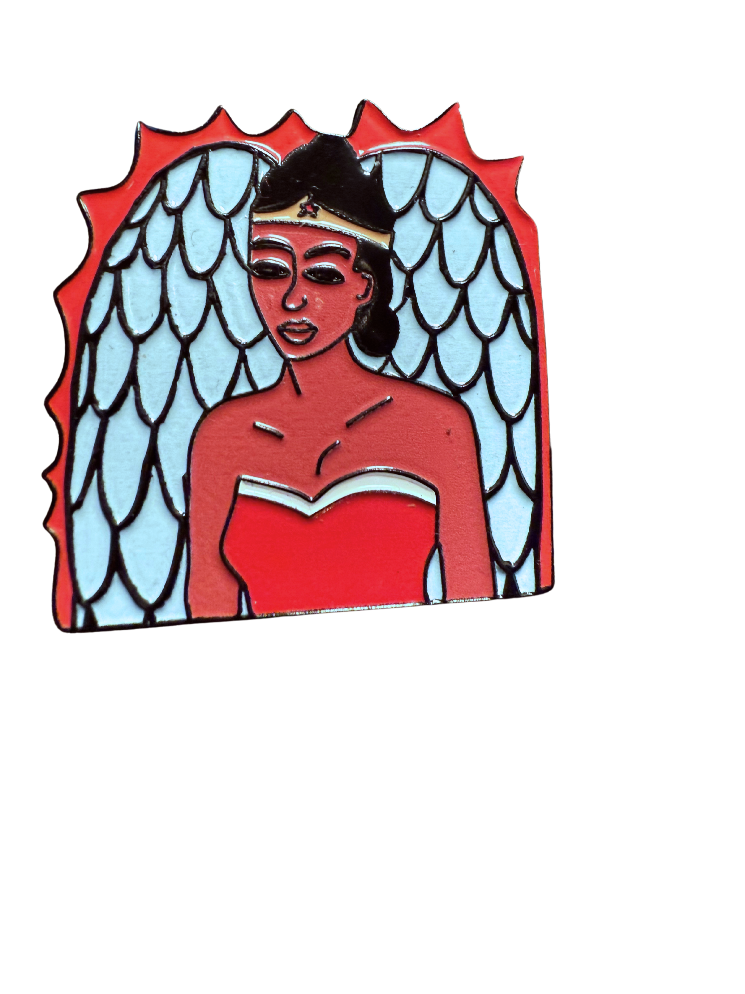 Colorful enamel pin of a woman with dark hair, a tiara, red strapless dress, and angel wings.