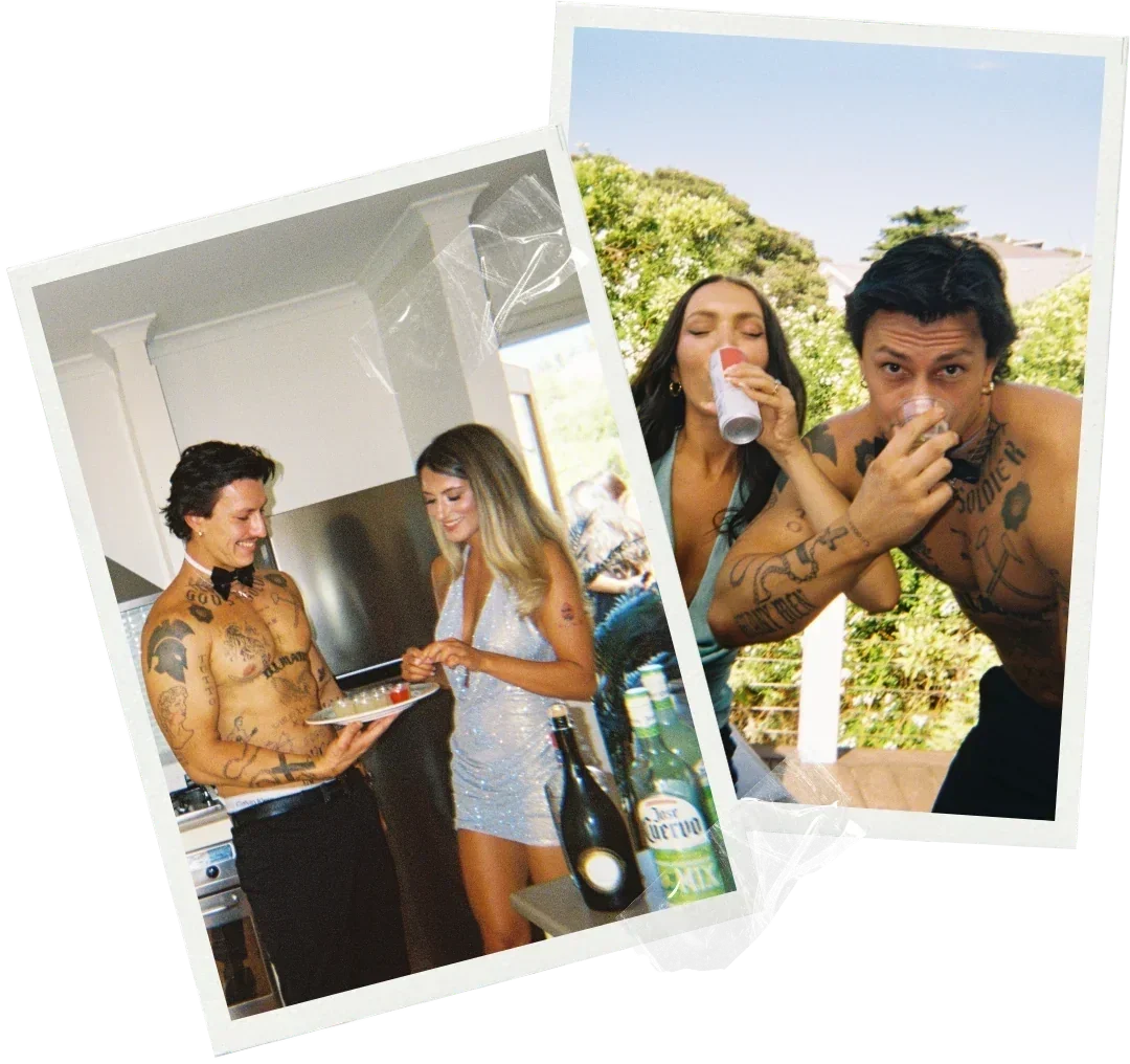 a topless waiter serving drinks to a bride and drinking with a bridesmaid at a sunny outdoor hens party in Mudgee
