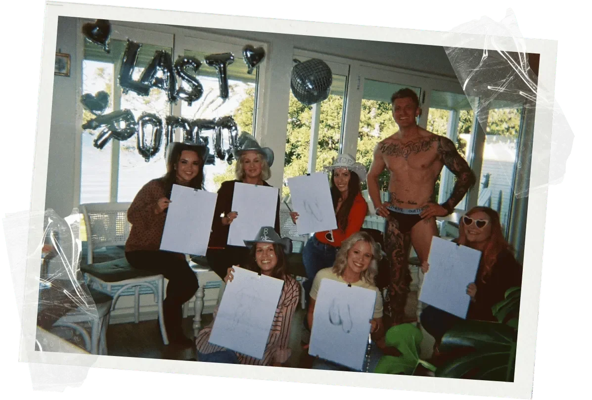 A hens party group laughing through the gamified rounds of a 1-800 HOT COPS life drawing class