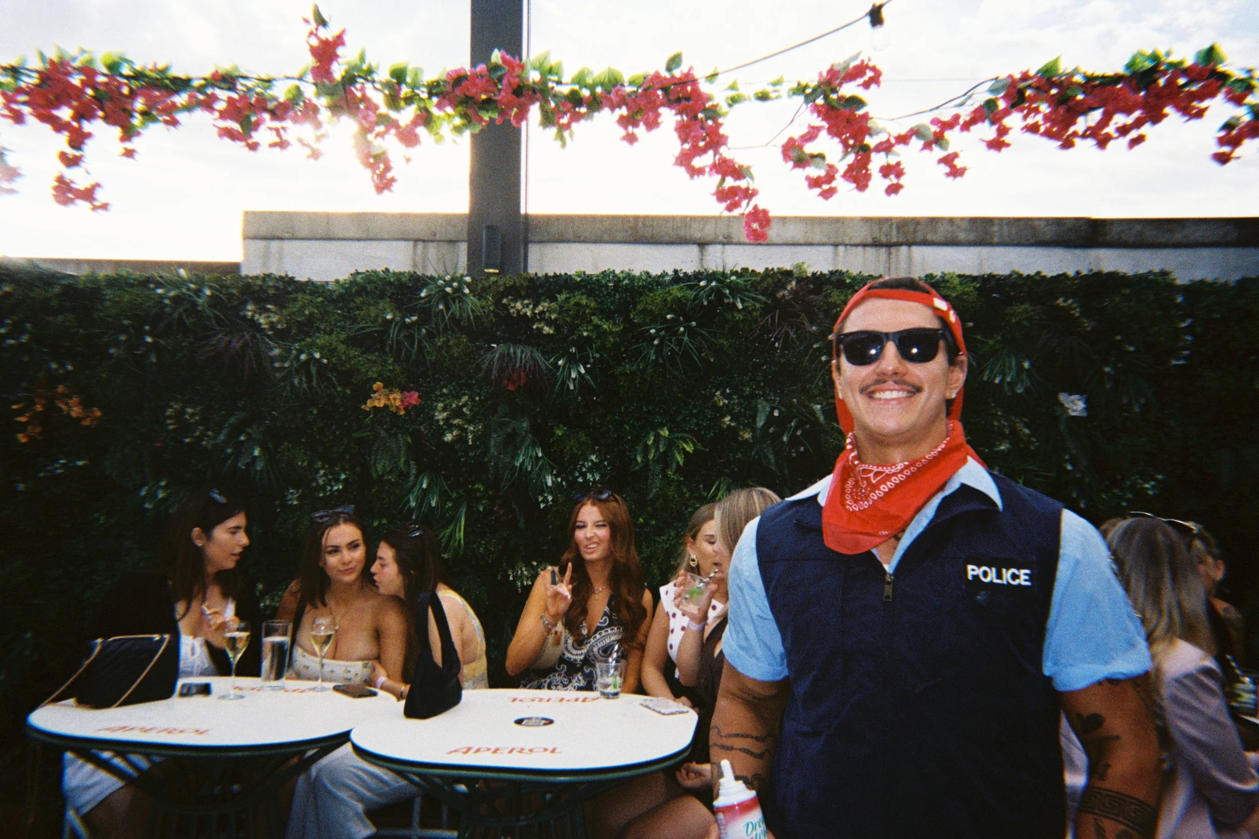 1800hotcops entertainer posing for a group photo with a group of hens