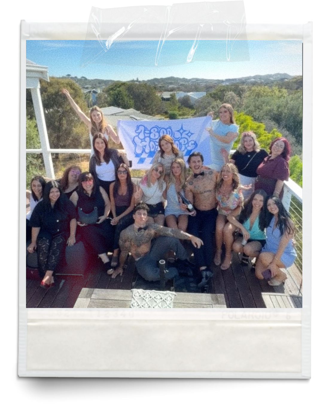 Newcastle topless waiter hens party package — 1-800 HOT COPS shirtless bartender with group at a Newcastle hens party