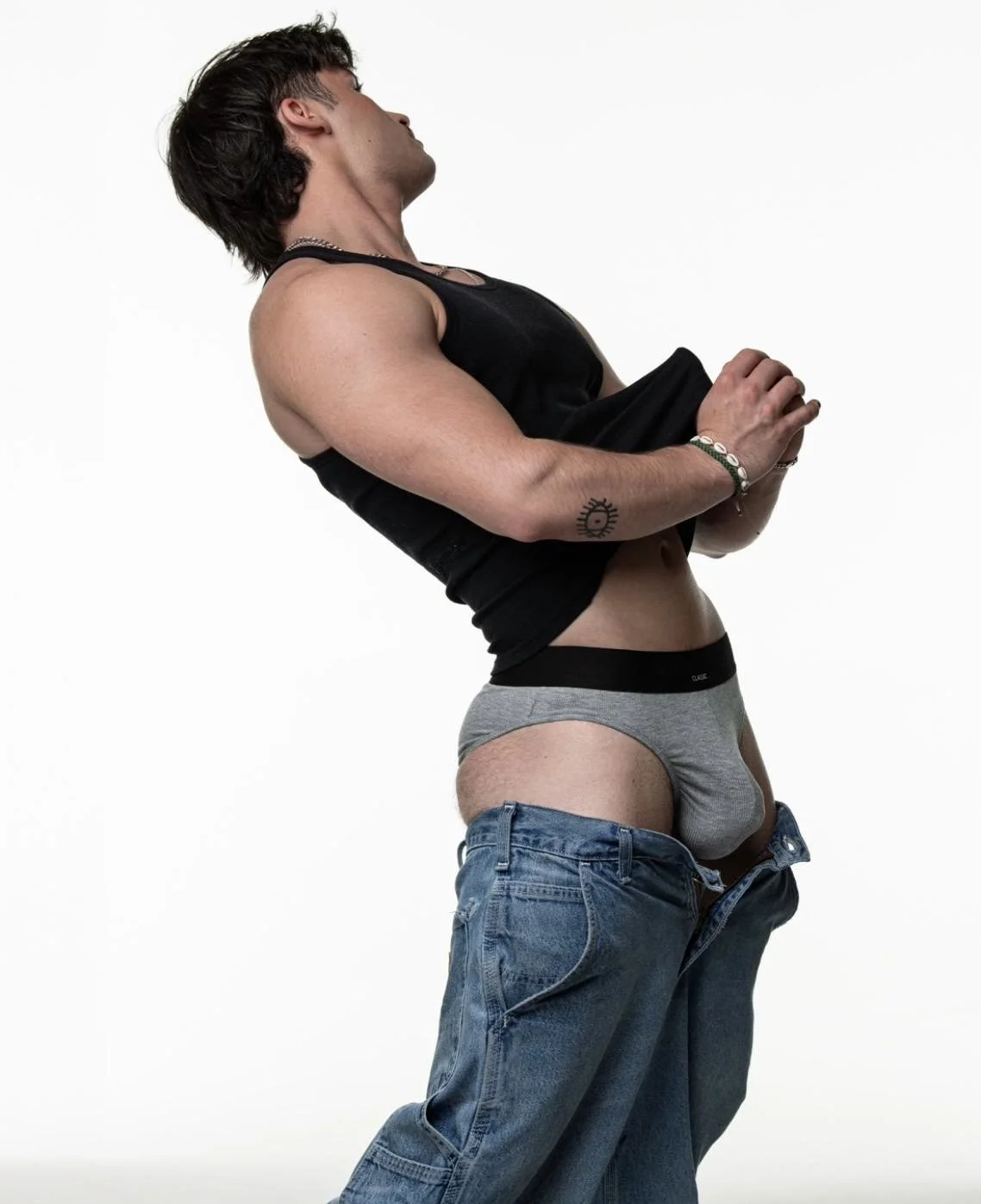 Joey Vegas flexing in a black tank top - male entertainer for hens parties on the Mornington Peninsula.