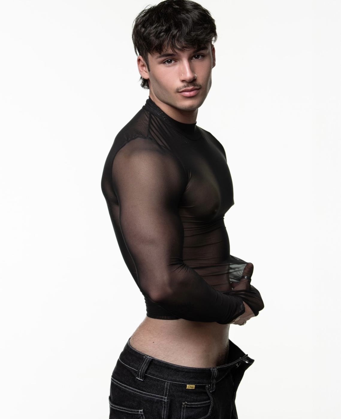 Joey Vegas posing in a black tank top - Mornington Peninsula hens party entertainer.