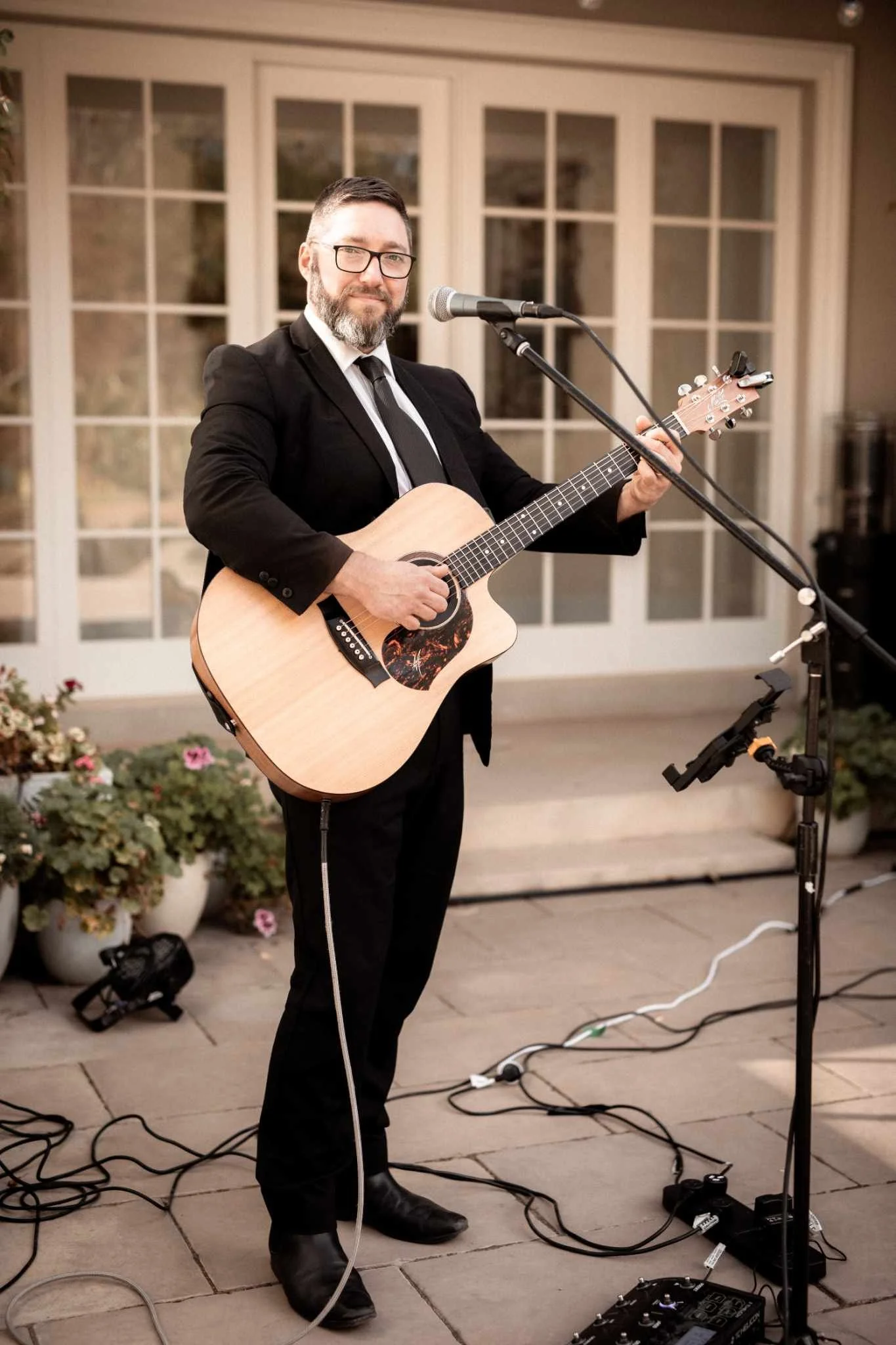Solo artist, Adelaide musician Jasper C Music, plays acoustic guitar at wedding.